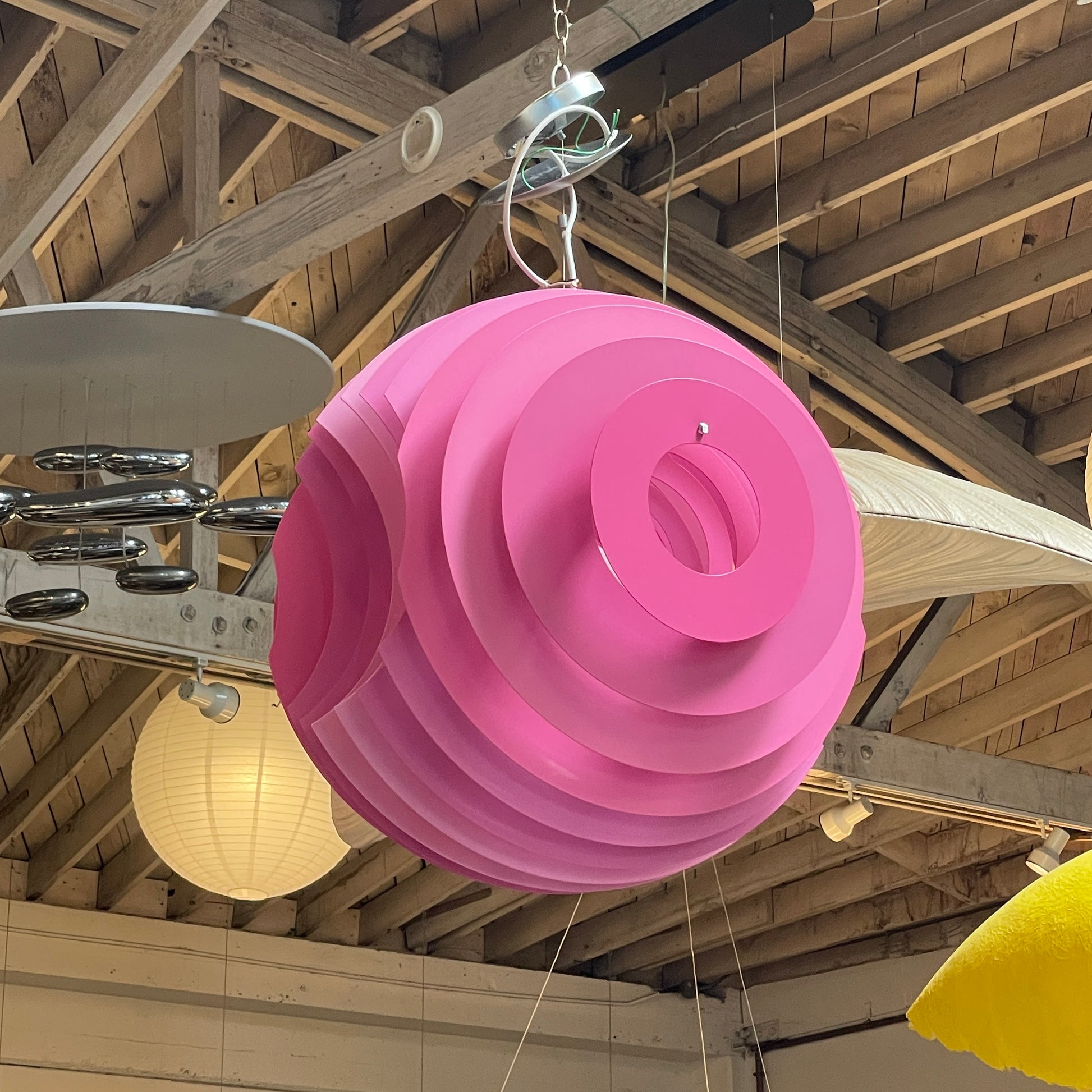 Modern Foscarini Supernova purple pendant light with concentric circular design.