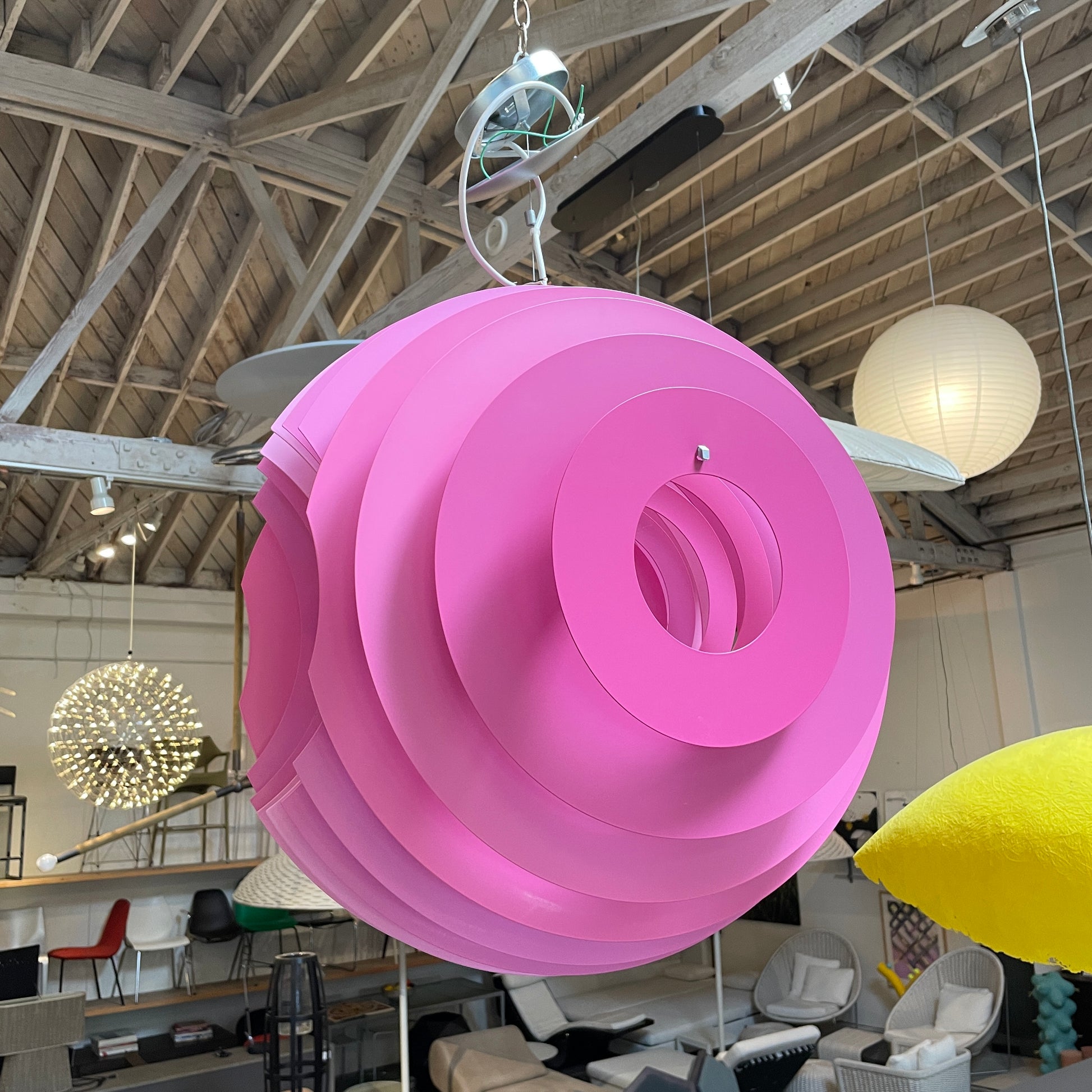 Modern Foscarini Supernova purple pendant light with concentric circular design.