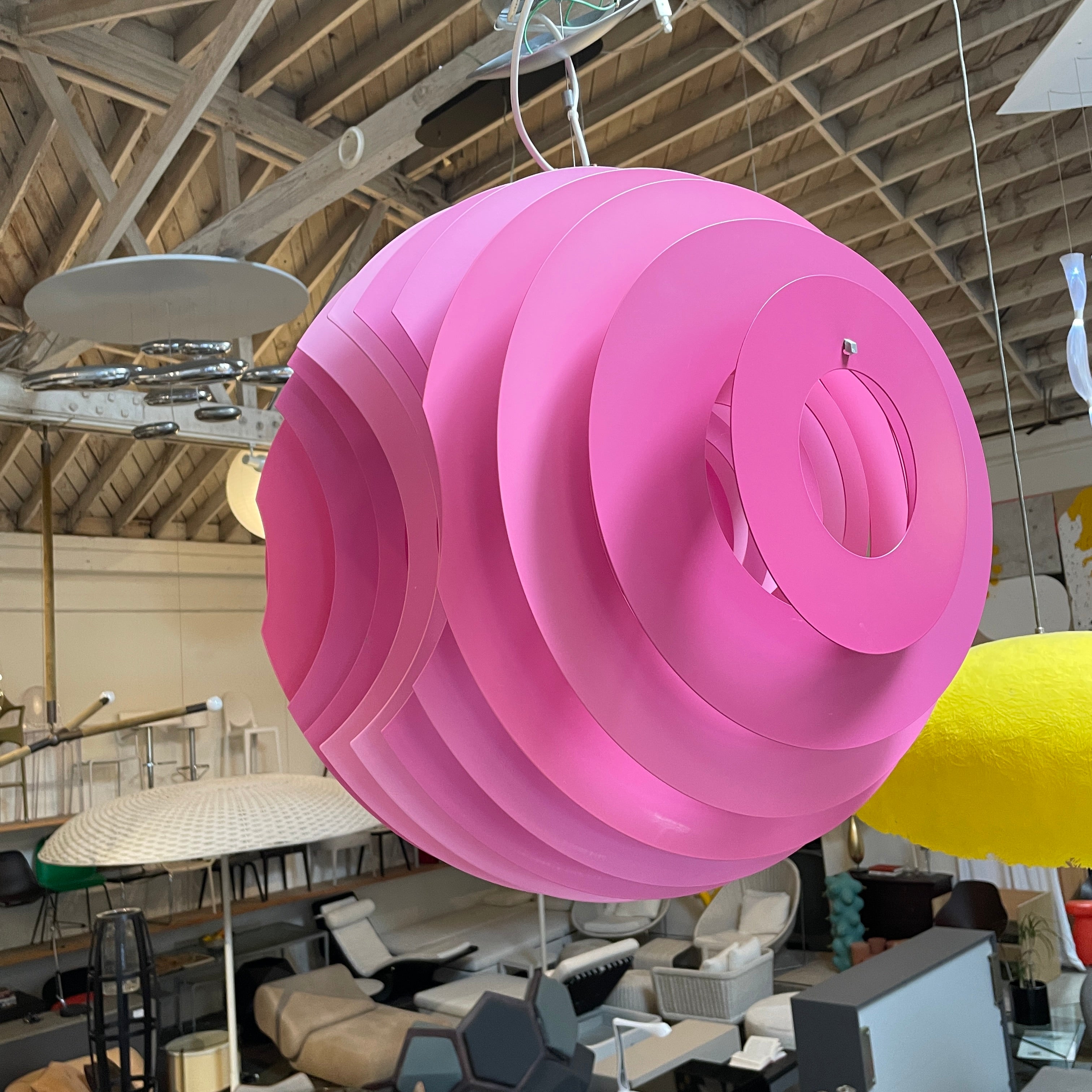 Modern Foscarini Supernova purple pendant light with concentric circular design.