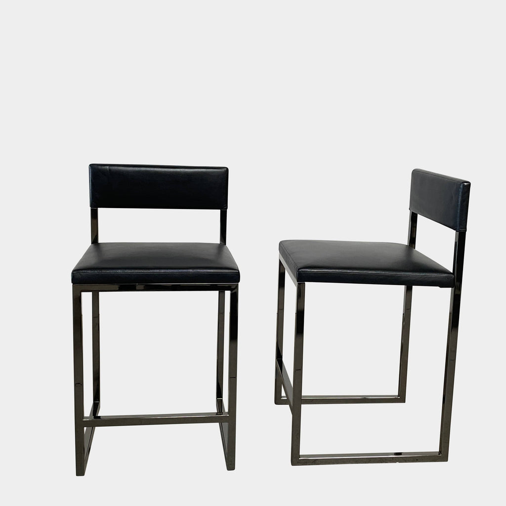 Three Minotti Bag Light Counter Height Stool Sets with black leather upholstery on a white background.