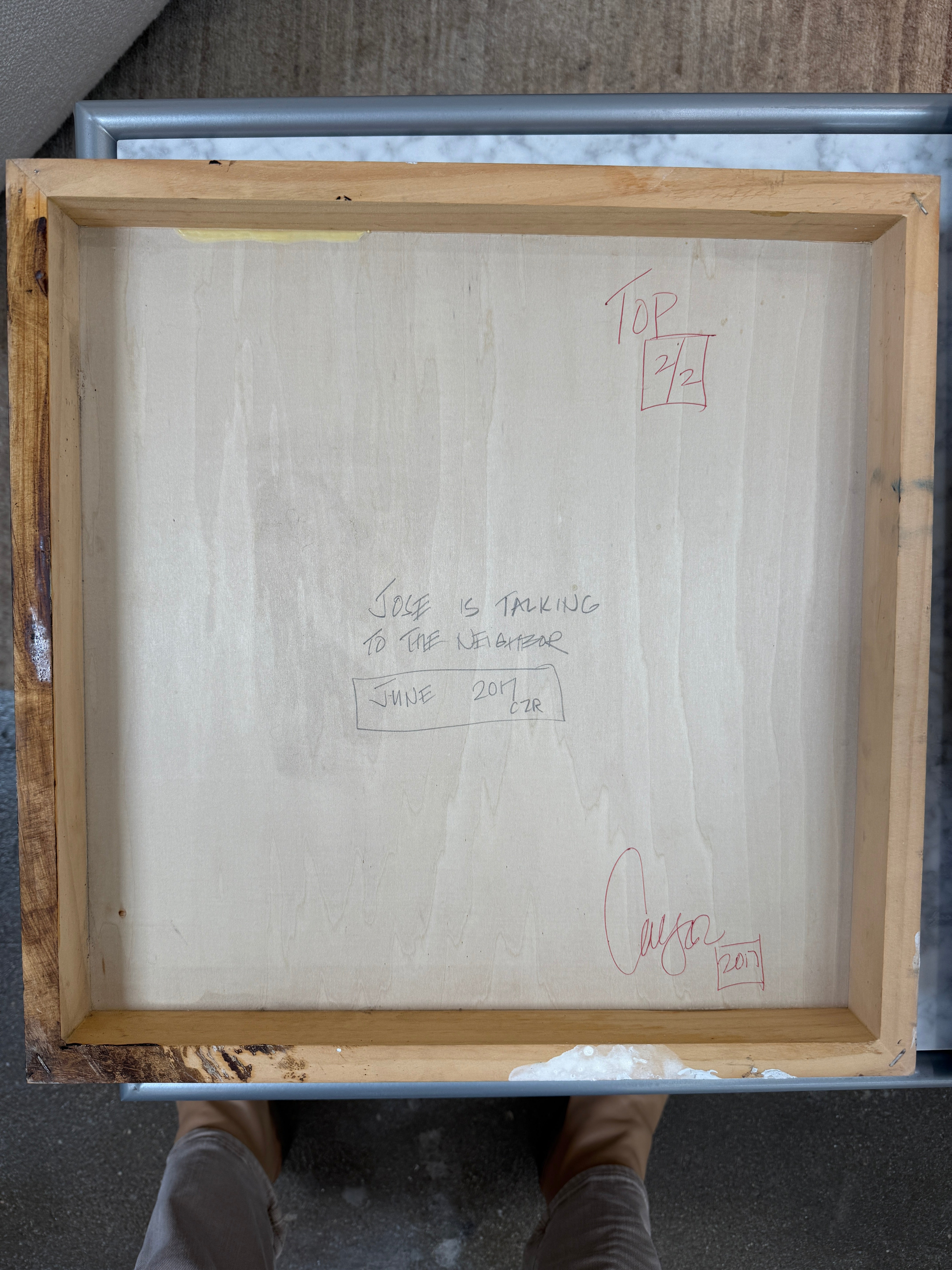 The Diptych, "Jose Is Talking To The Neighbor" by Artist, features abstract paintings with a striking interplay of black, white, and gray. The left canvas has angular shapes contrasted by more rounded forms on the right, set against a plain white background.