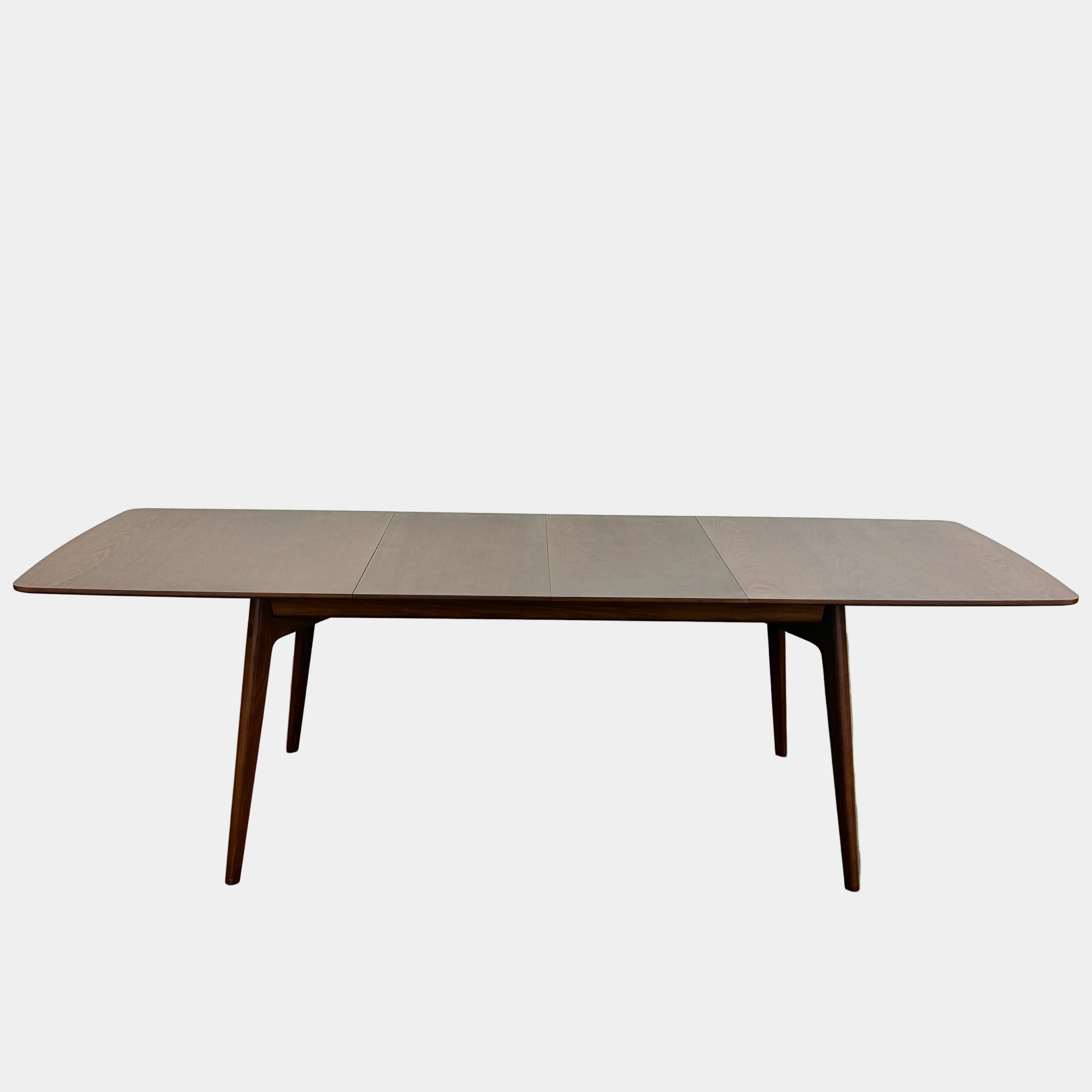 The Case Design Dulwich Extension Table by Case is an elegant rectangular walnut dining table with four legs and a smooth, flat surface, viewed from the front against a plain white background—ideal for modern dining spaces.