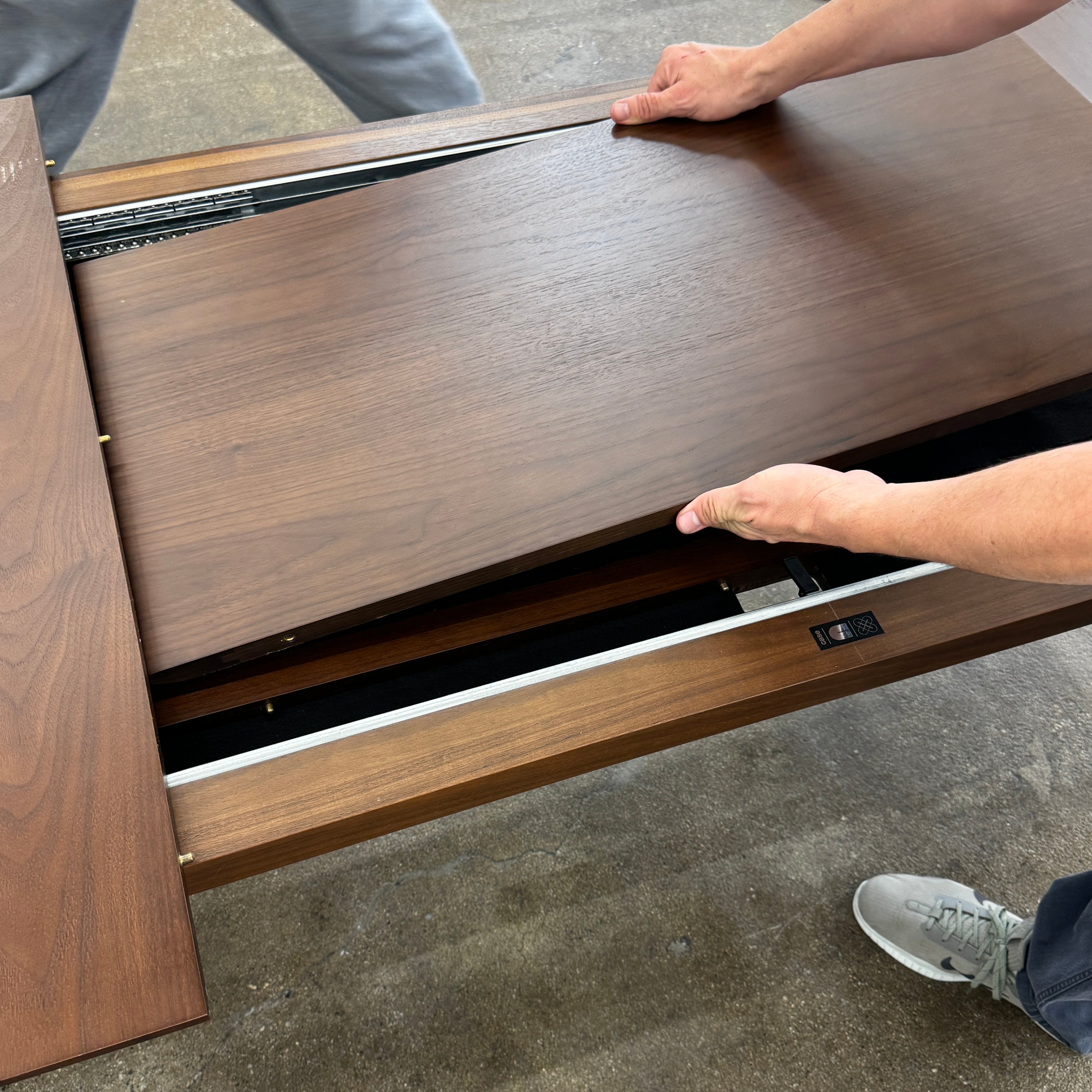 The Case Design Dulwich Extension Table by Case is an elegant rectangular walnut dining table with four legs and a smooth, flat surface, viewed from the front against a plain white background—ideal for modern dining spaces.