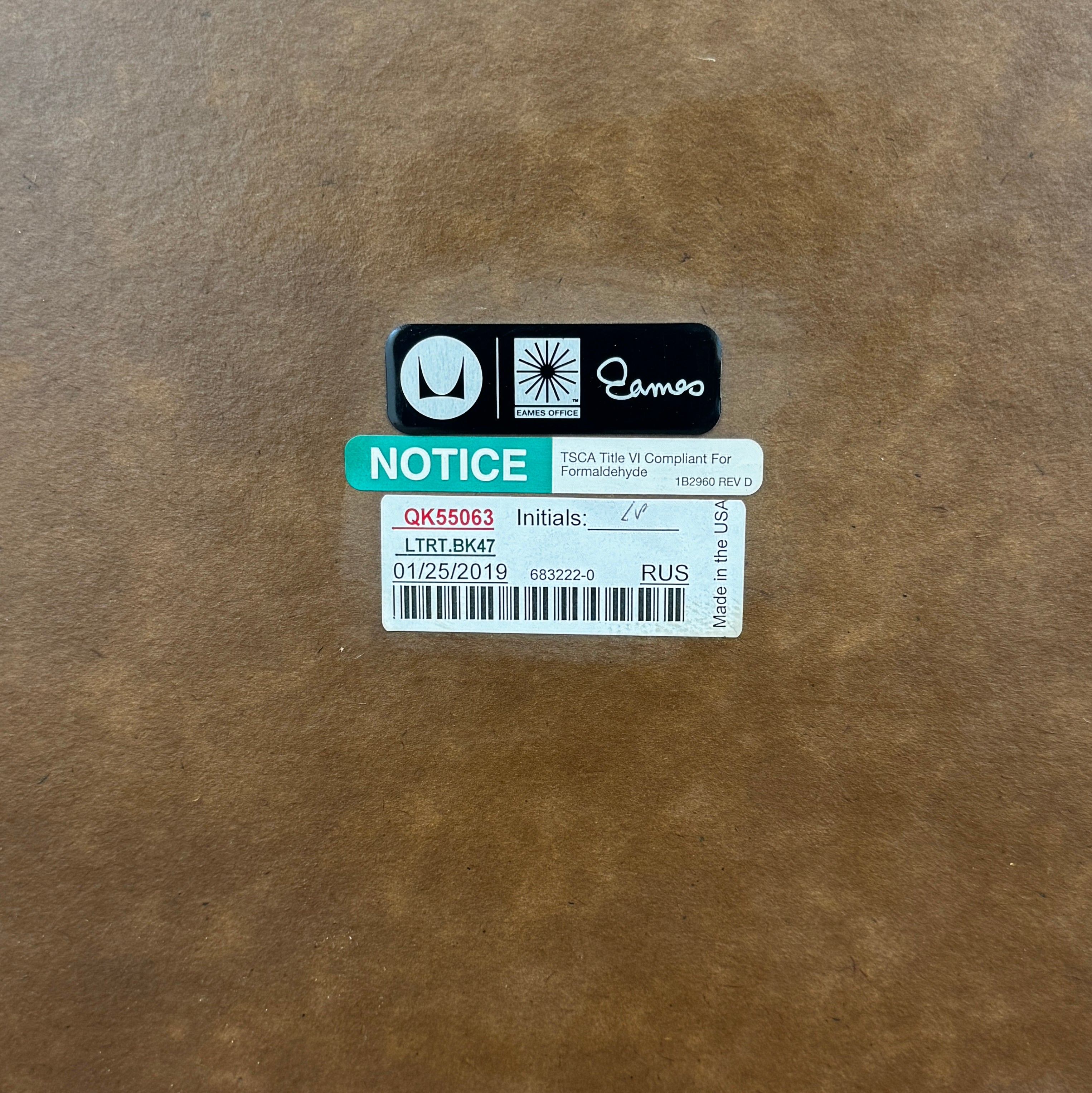 Two Herman Miller Eames Wire Base Low Tables are set side by side on a light wood floor in a bright, minimalist room, showcasing the iconic design and craftsmanship of Herman Miller.