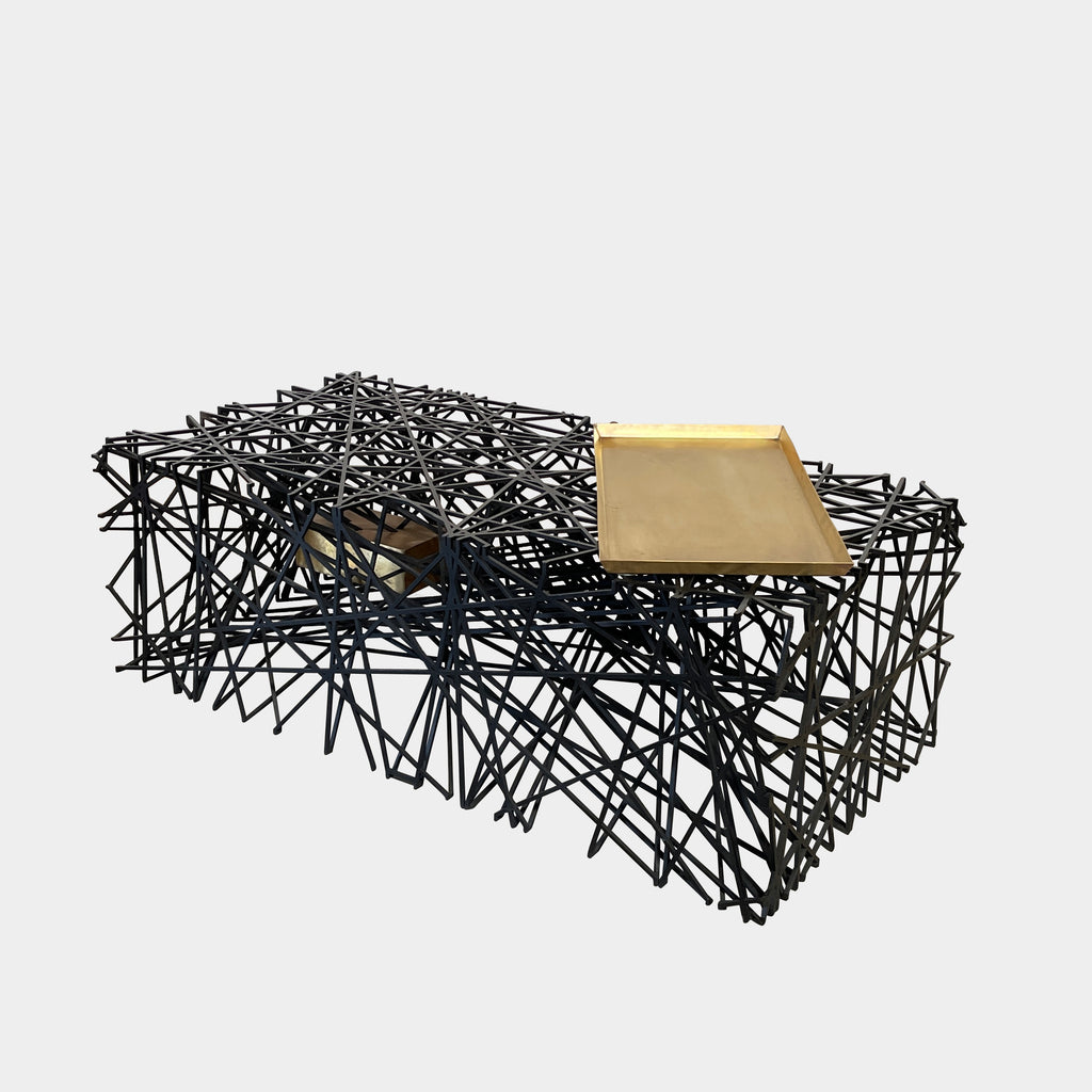 A modern SOMA Layered Fabrics Table inspired by historical cities, with a black metal geometric base and a gold-toned tabletop.
