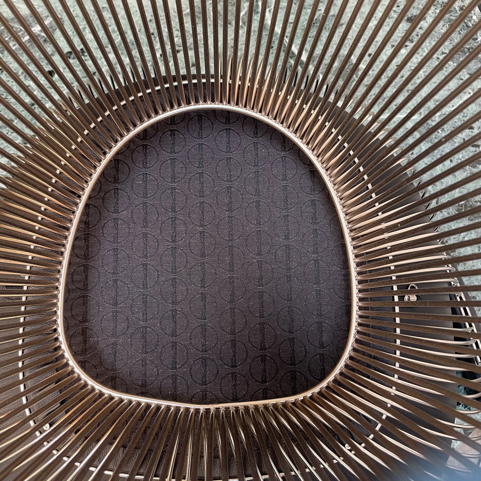 A set of six Knoll Platner Armchairs by Knoll, featuring black seats and backs with metal wire bases, inspired by modernist design, arranged in two rows against a plain white background.