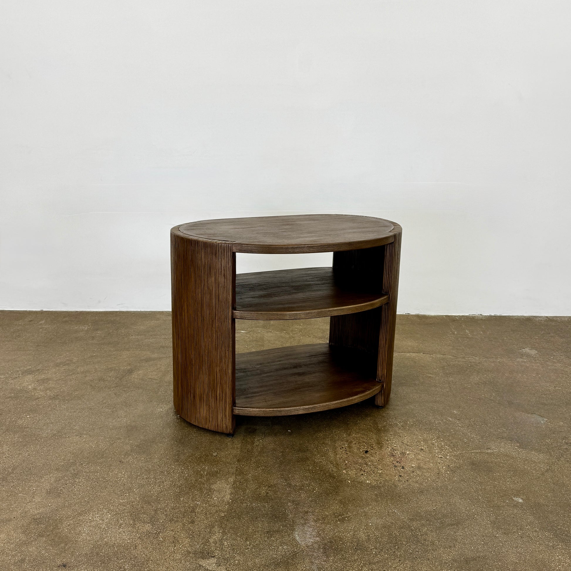The Palachek Leonardo Side Table, Large, by Palachek features artisan craftsmanship, a dark brown finish, two shelves, and an open minimalist design that suits any contemporary decor against a plain white background.