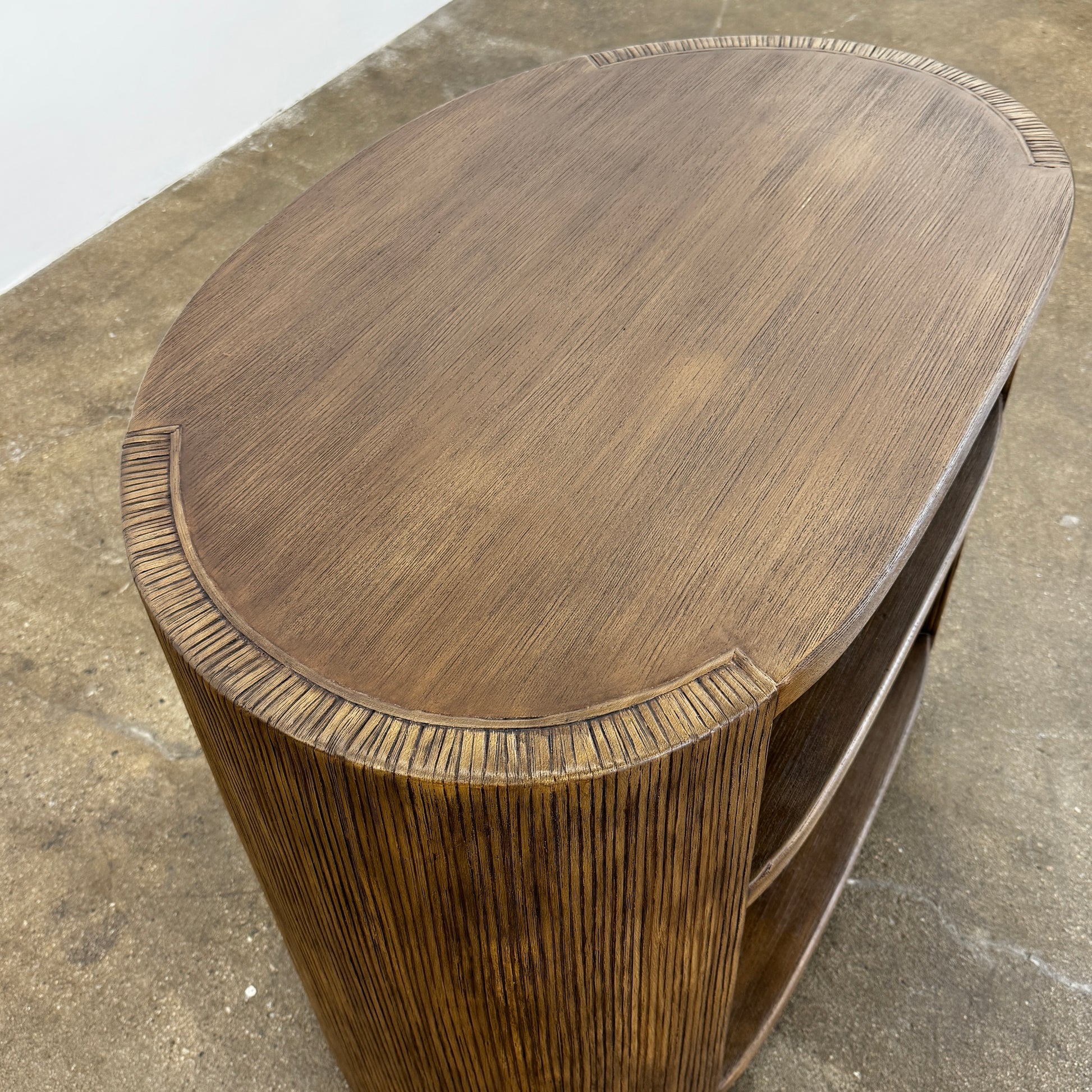 The Palachek Leonardo Side Table, Large, by Palachek features artisan craftsmanship, a dark brown finish, two shelves, and an open minimalist design that suits any contemporary decor against a plain white background.