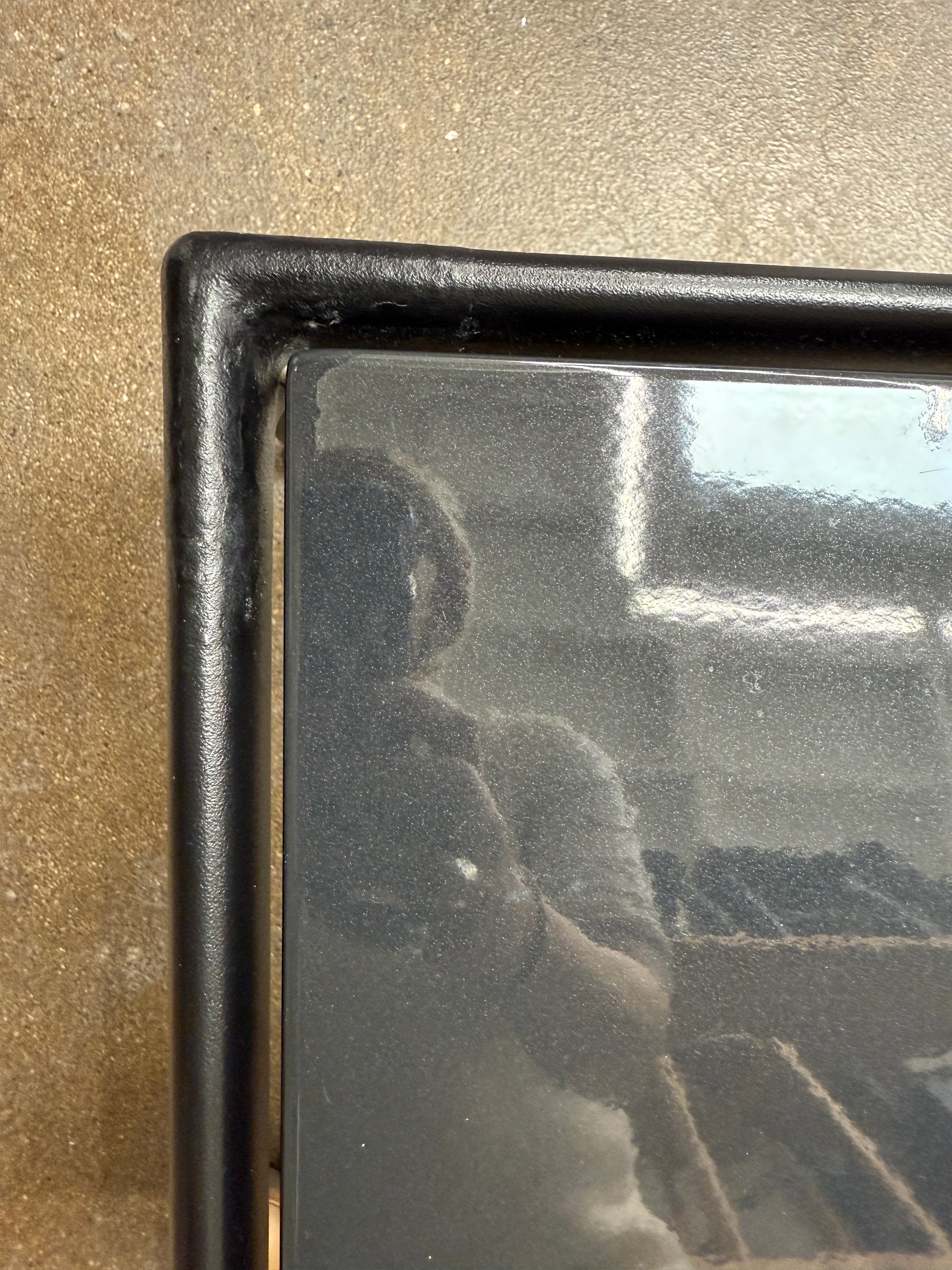 The Knoll 1966 Outdoor End Table in Onyx features four straight legs with rounded feet and a weather-resistant finish, making it ideal for outdoor living. Shown against a plain white background.