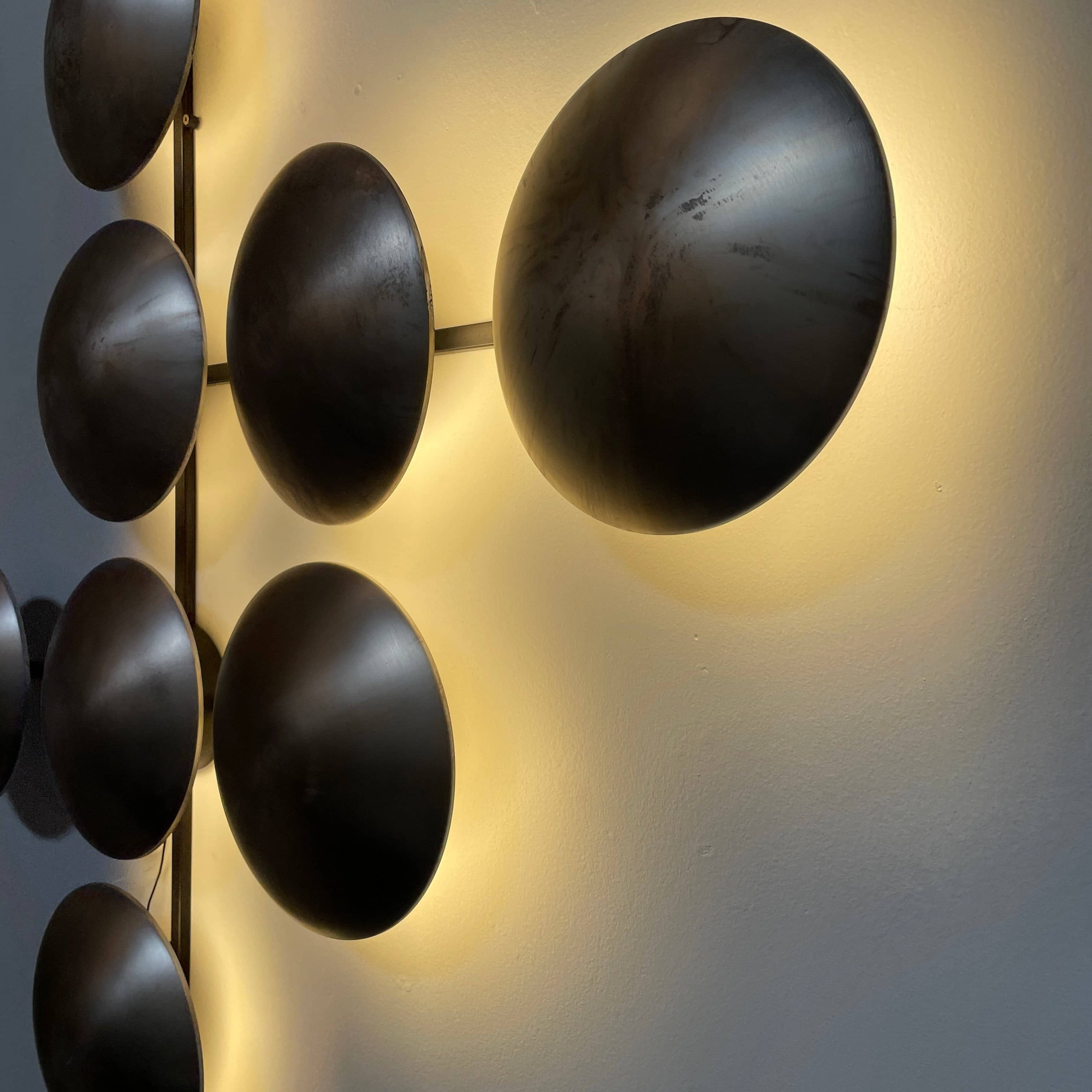 A group of Henge Wall Clips Light on a white background.