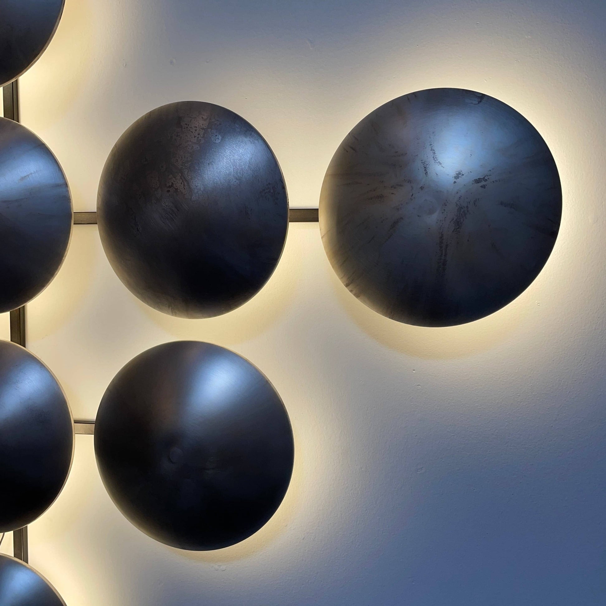 A group of Henge Wall Clips Light on a white background.