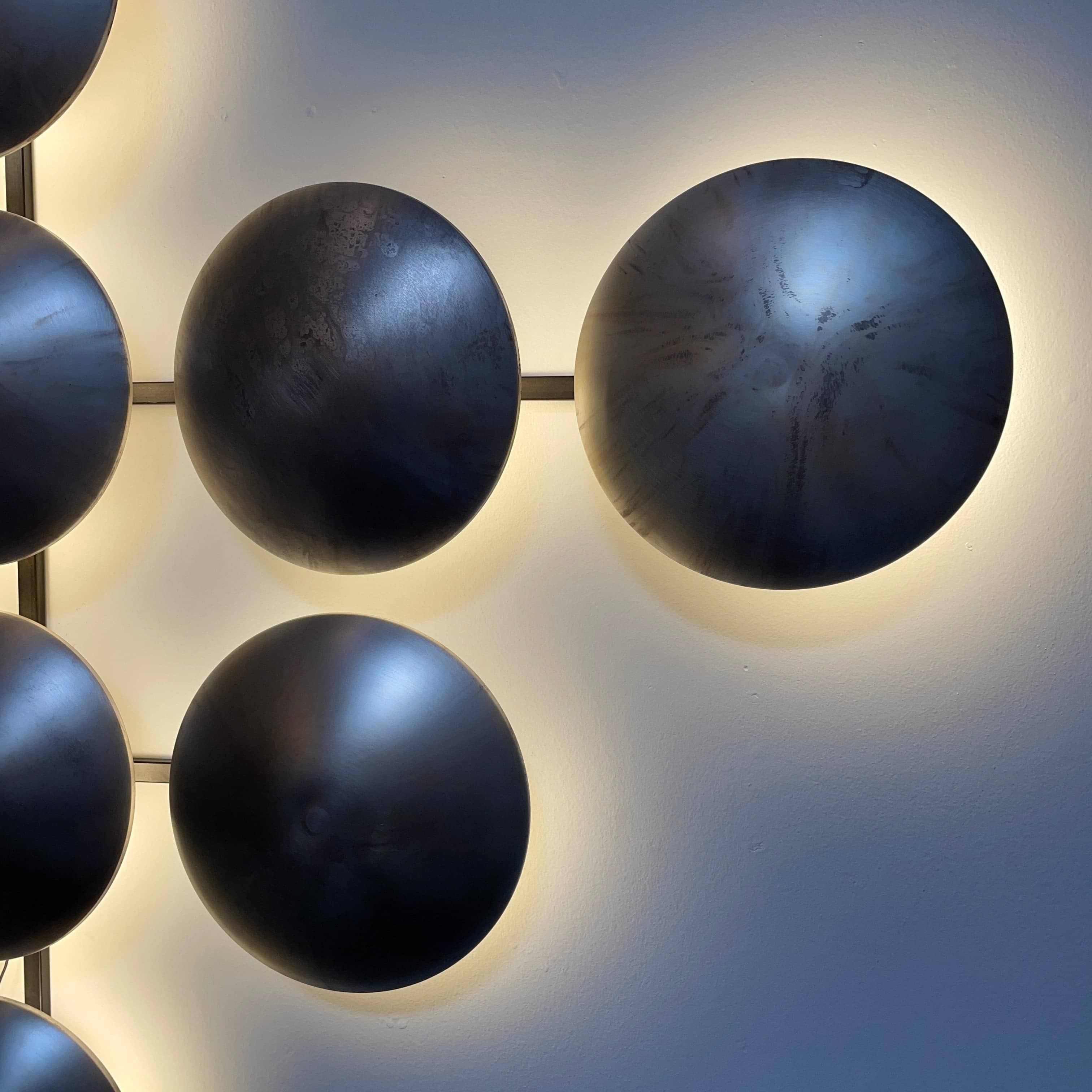 A group of Henge Wall Clips Light on a white background.