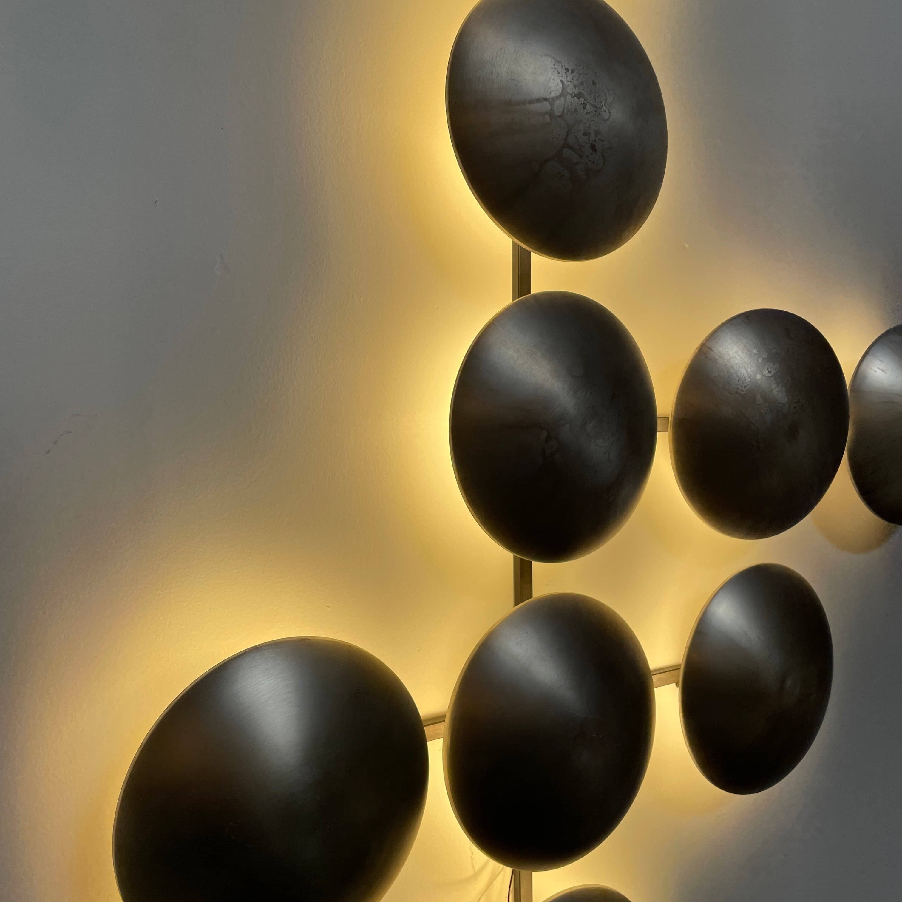 A group of Henge Wall Clips Light on a white background.