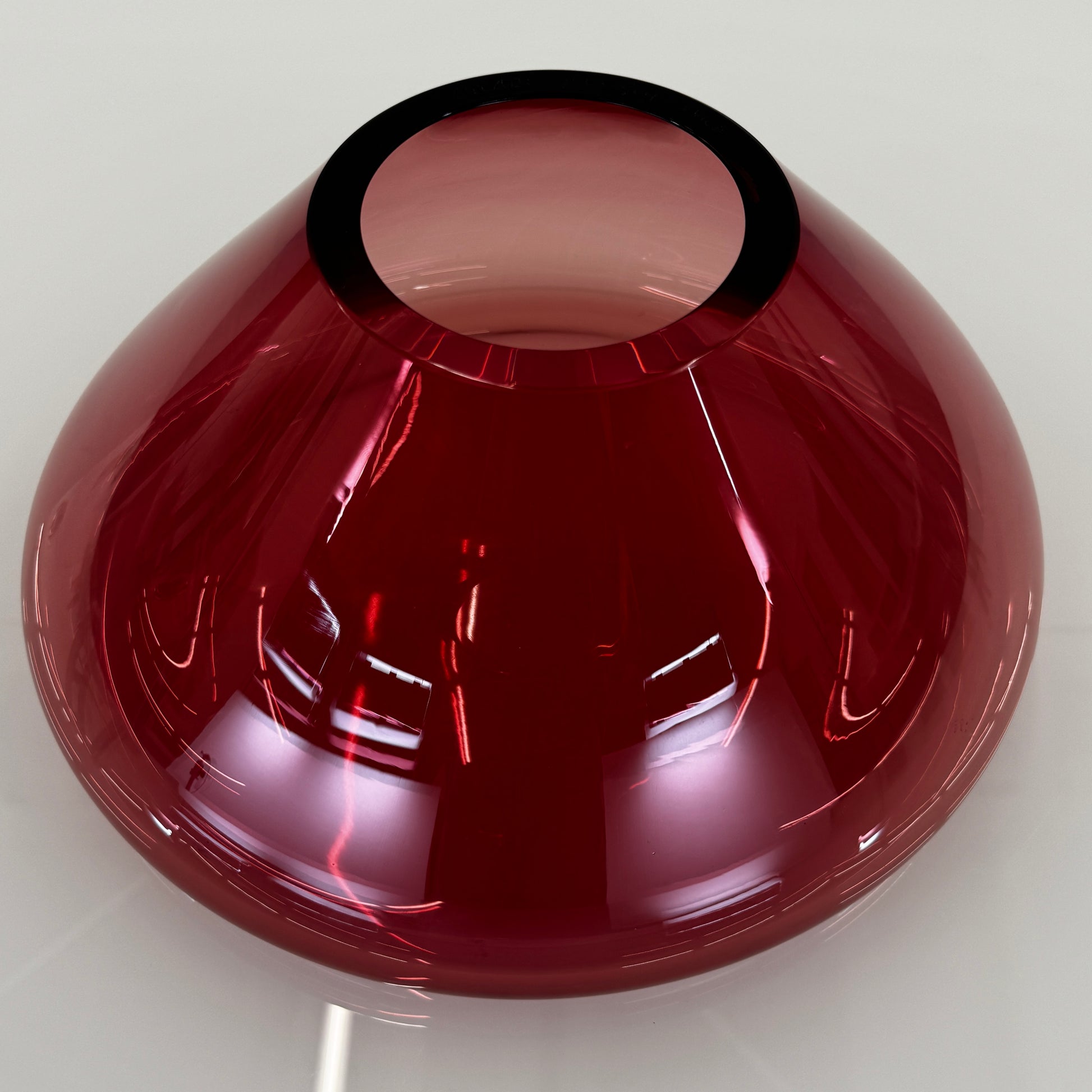 The Arcade Pink Murano Glass Vase by Arcade features pink, hand-blown elegance inspired by Venetian glassmaking, showcased against a plain white background.