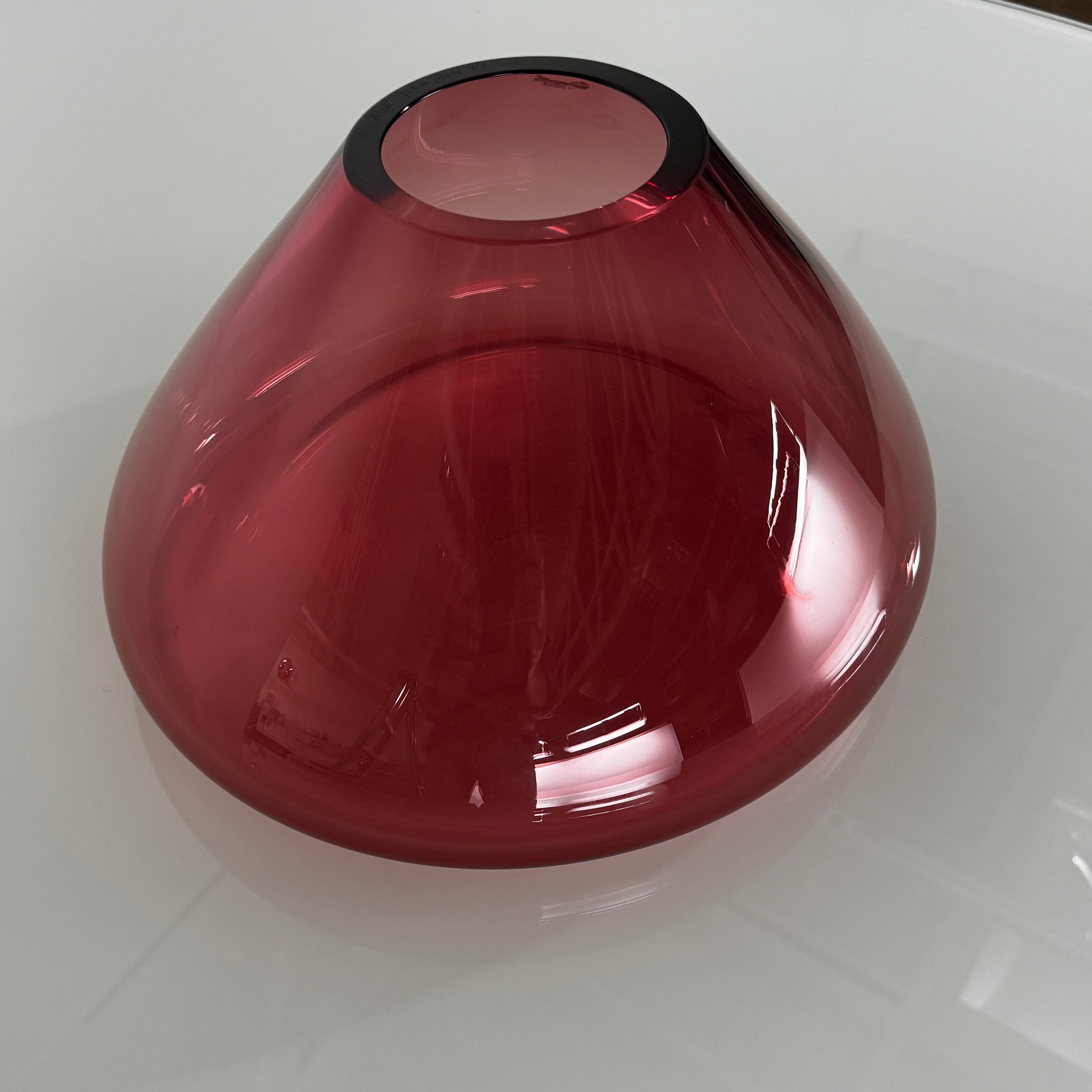 The Arcade Pink Murano Glass Vase by Arcade features pink, hand-blown elegance inspired by Venetian glassmaking, showcased against a plain white background.