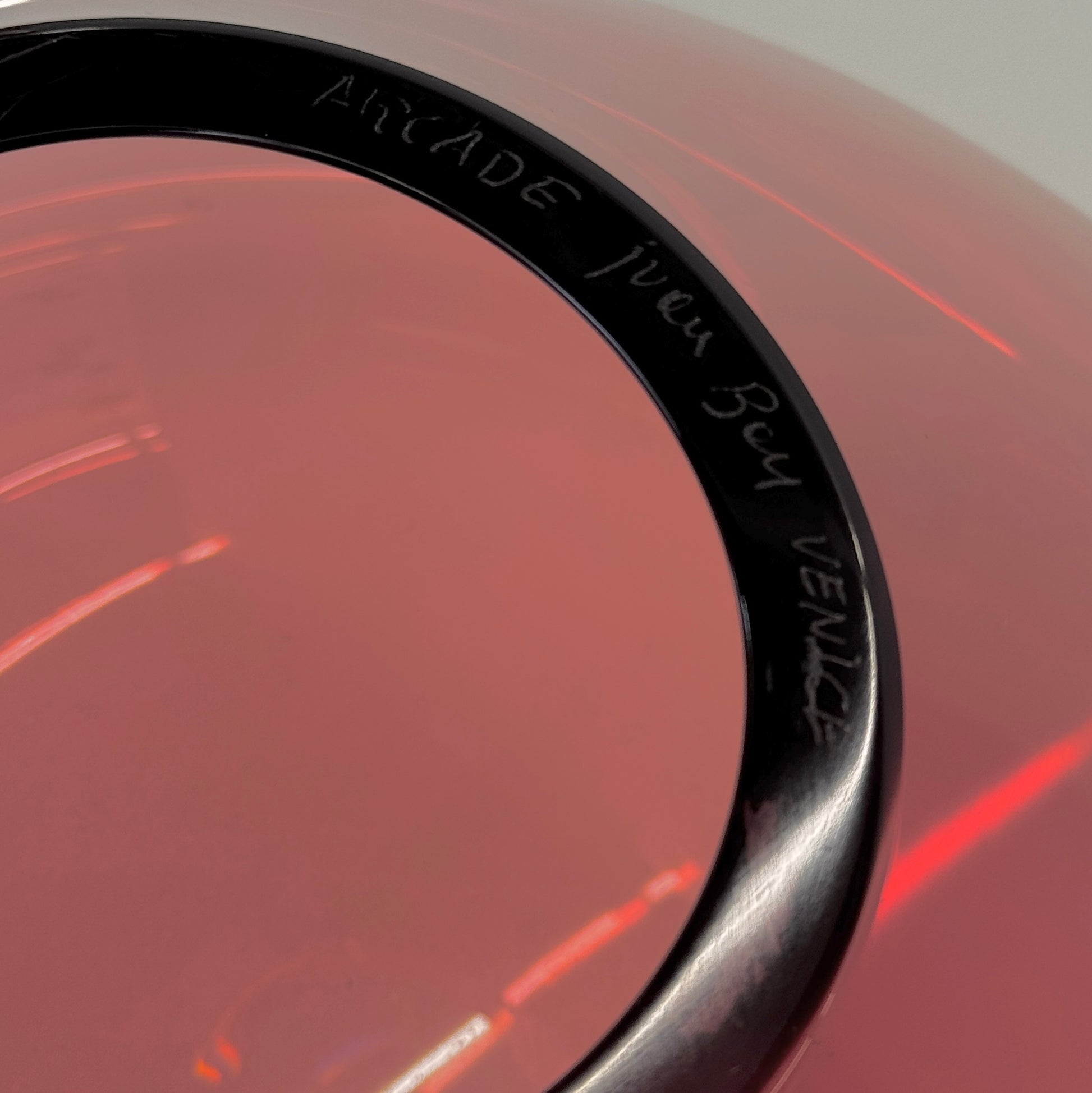 The Arcade Pink Murano Glass Vase by Arcade features pink, hand-blown elegance inspired by Venetian glassmaking, showcased against a plain white background.