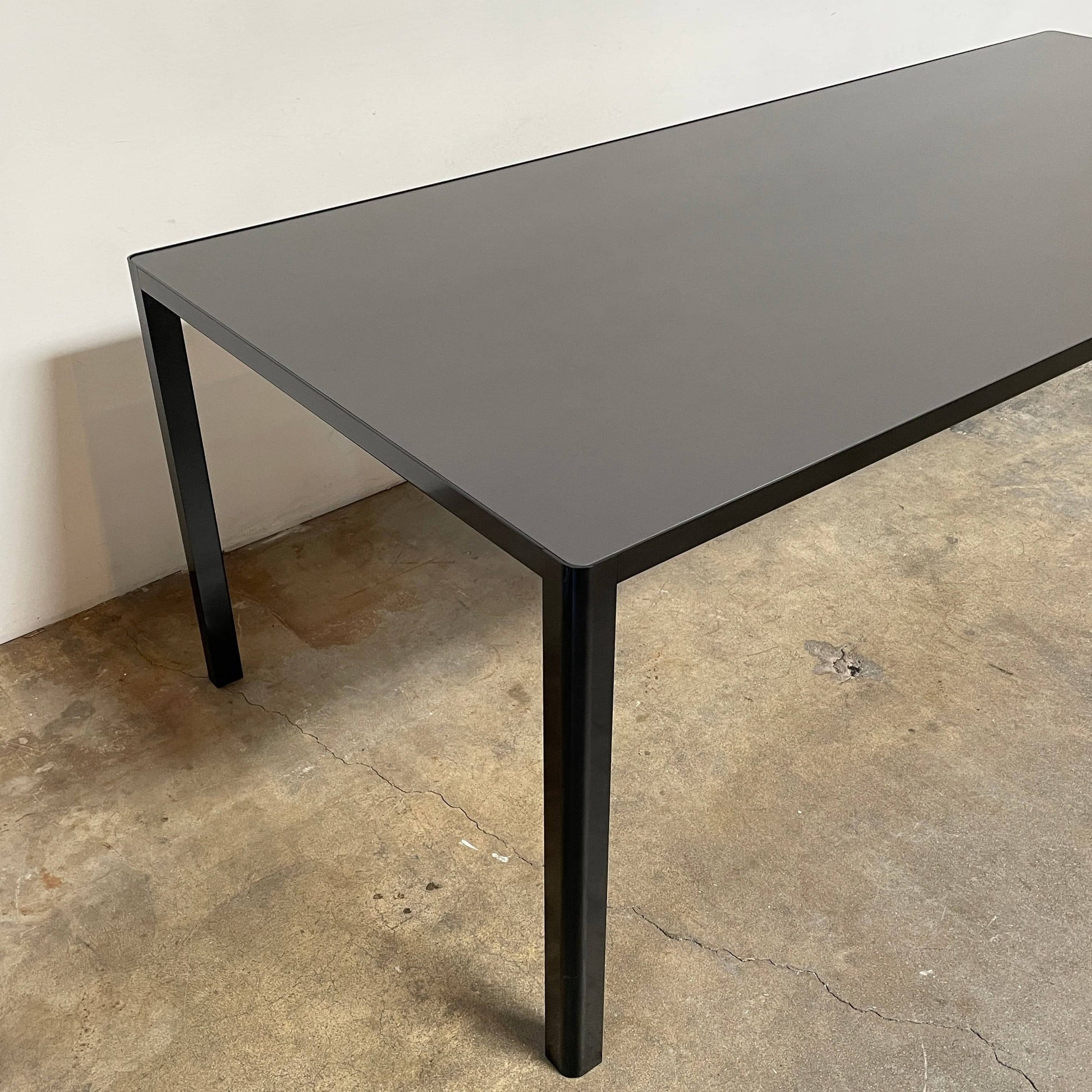 A simple Ligne Roset Seram Dining Table on a white background.