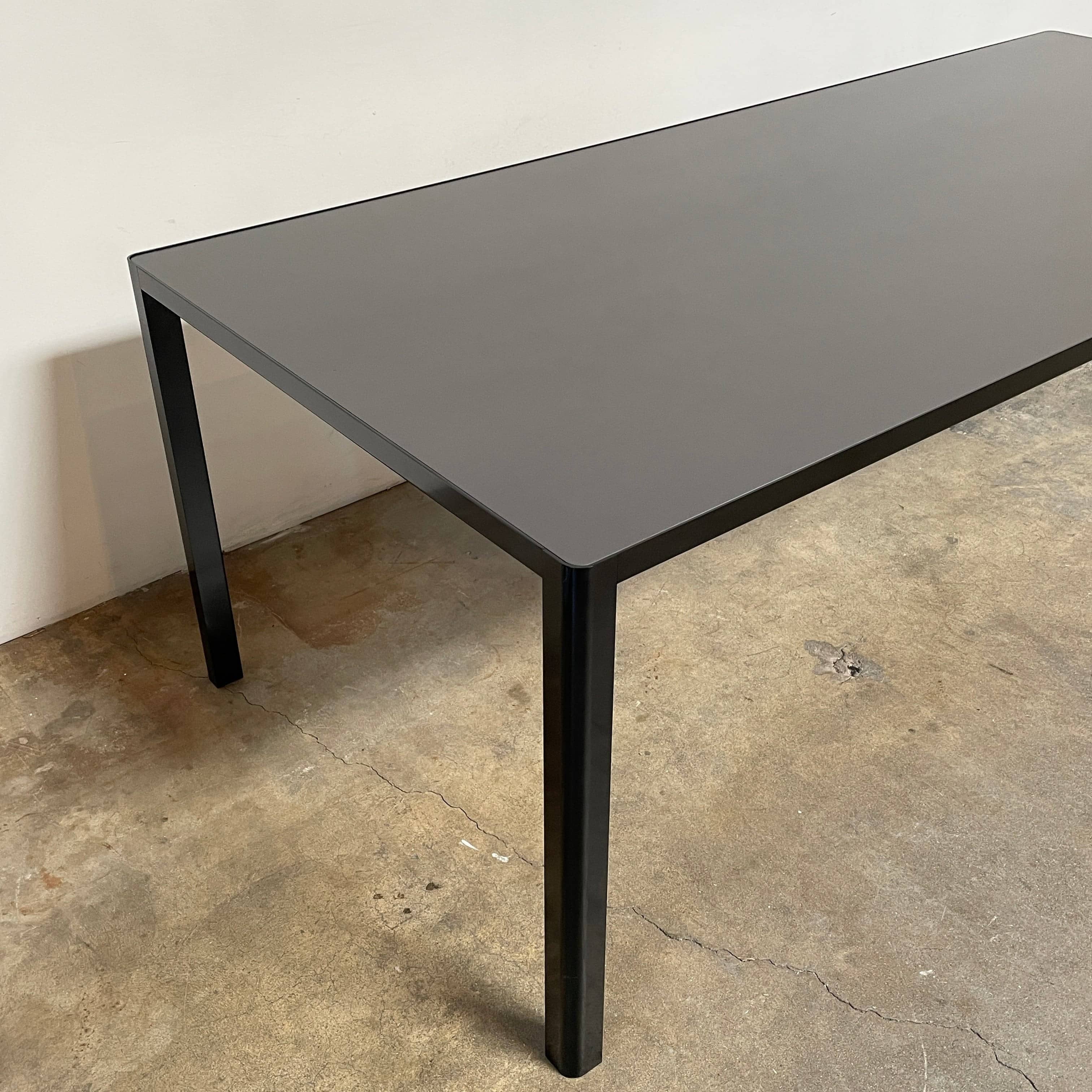 A simple Ligne Roset Seram Dining Table on a white background.