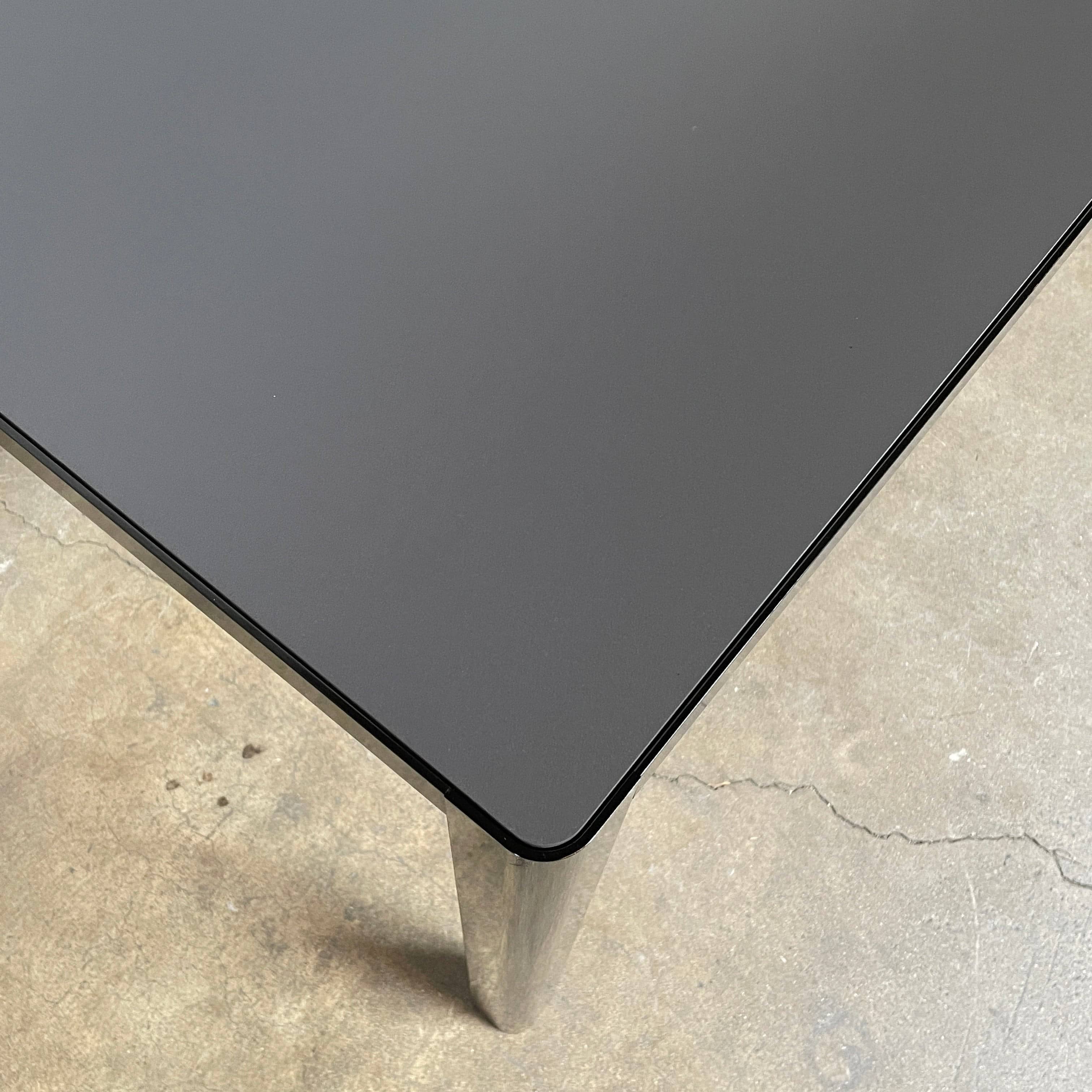 A simple Ligne Roset Seram Dining Table on a white background.