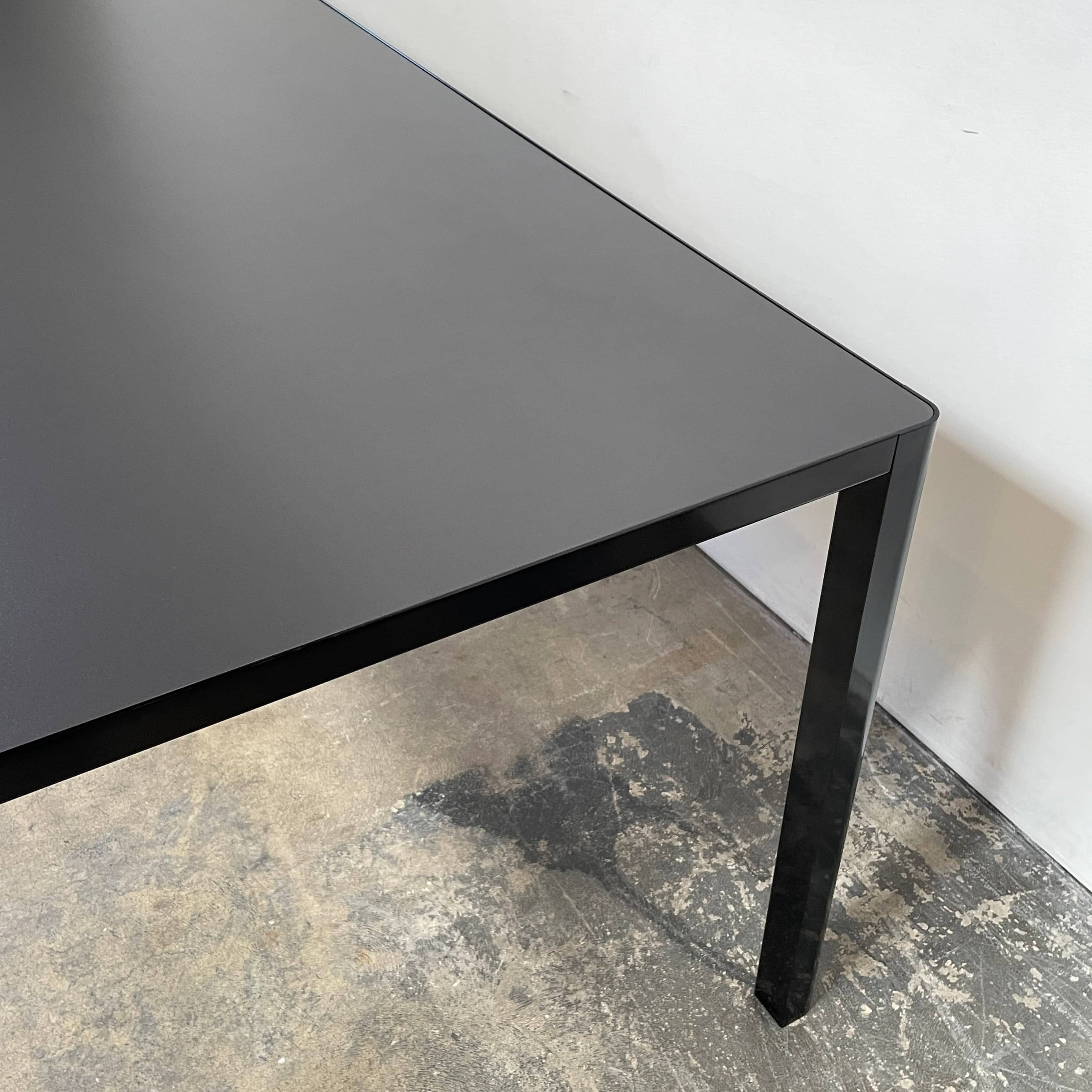 A simple Ligne Roset Seram Dining Table on a white background.