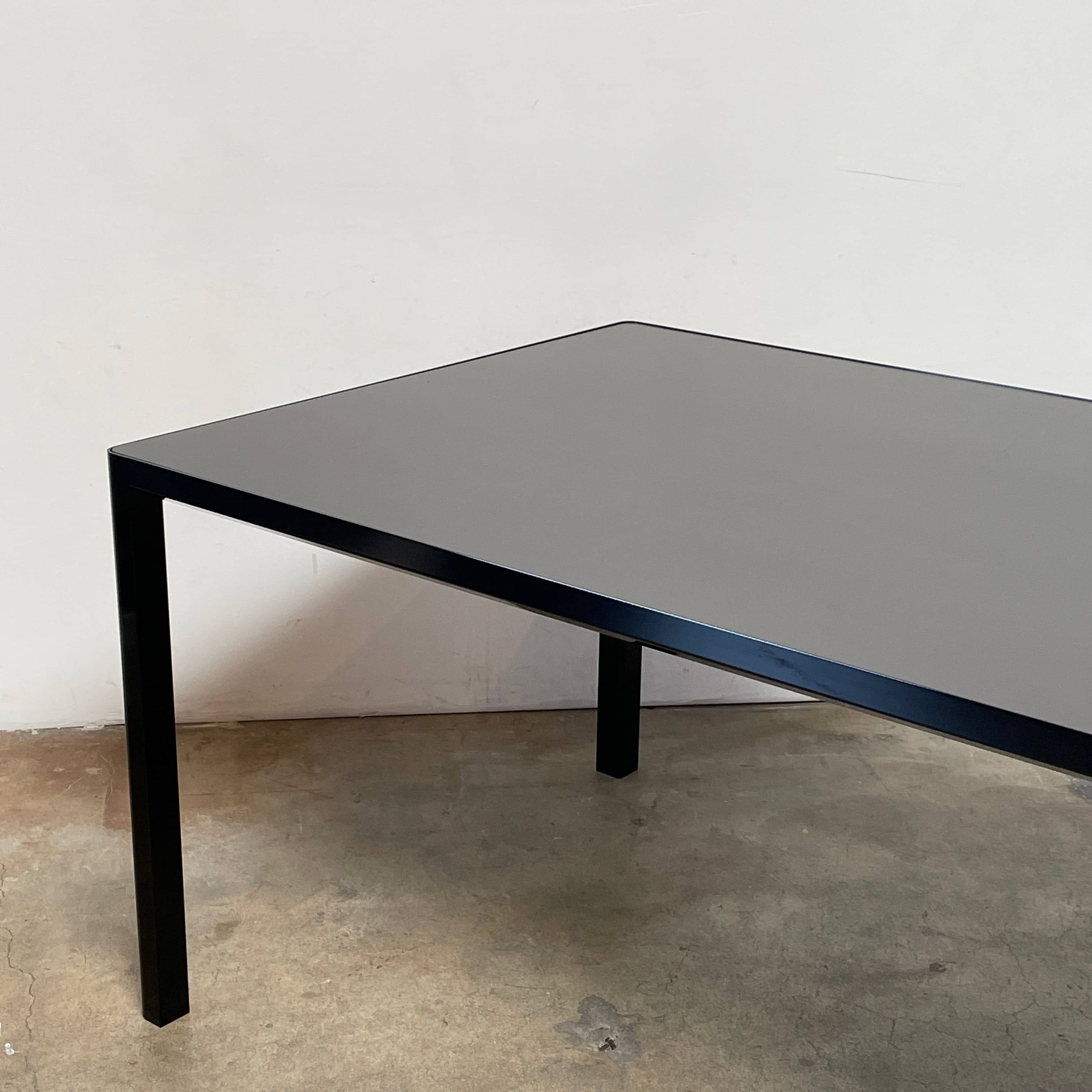 A simple Ligne Roset Seram Dining Table on a white background.