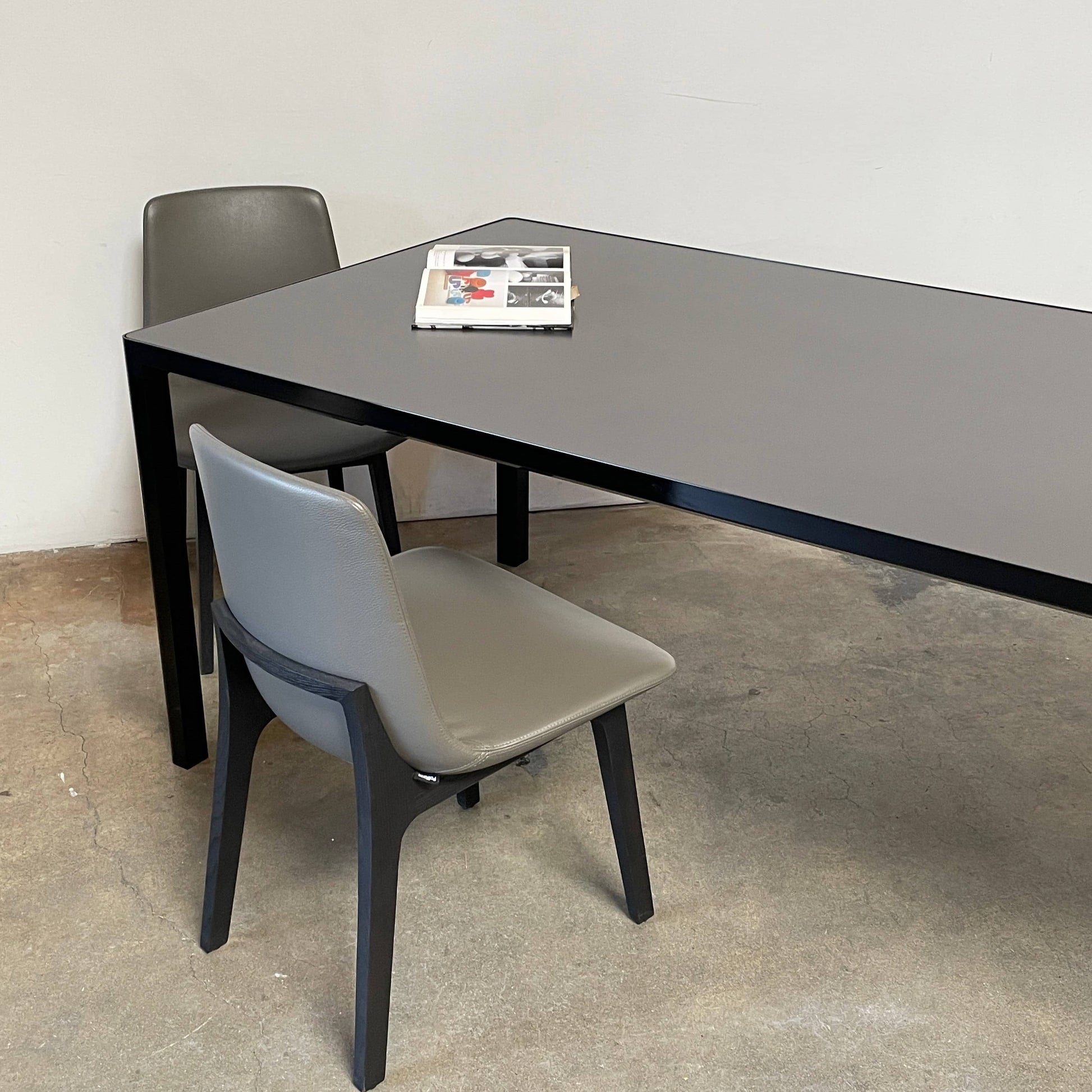 A simple Ligne Roset Seram Dining Table on a white background.