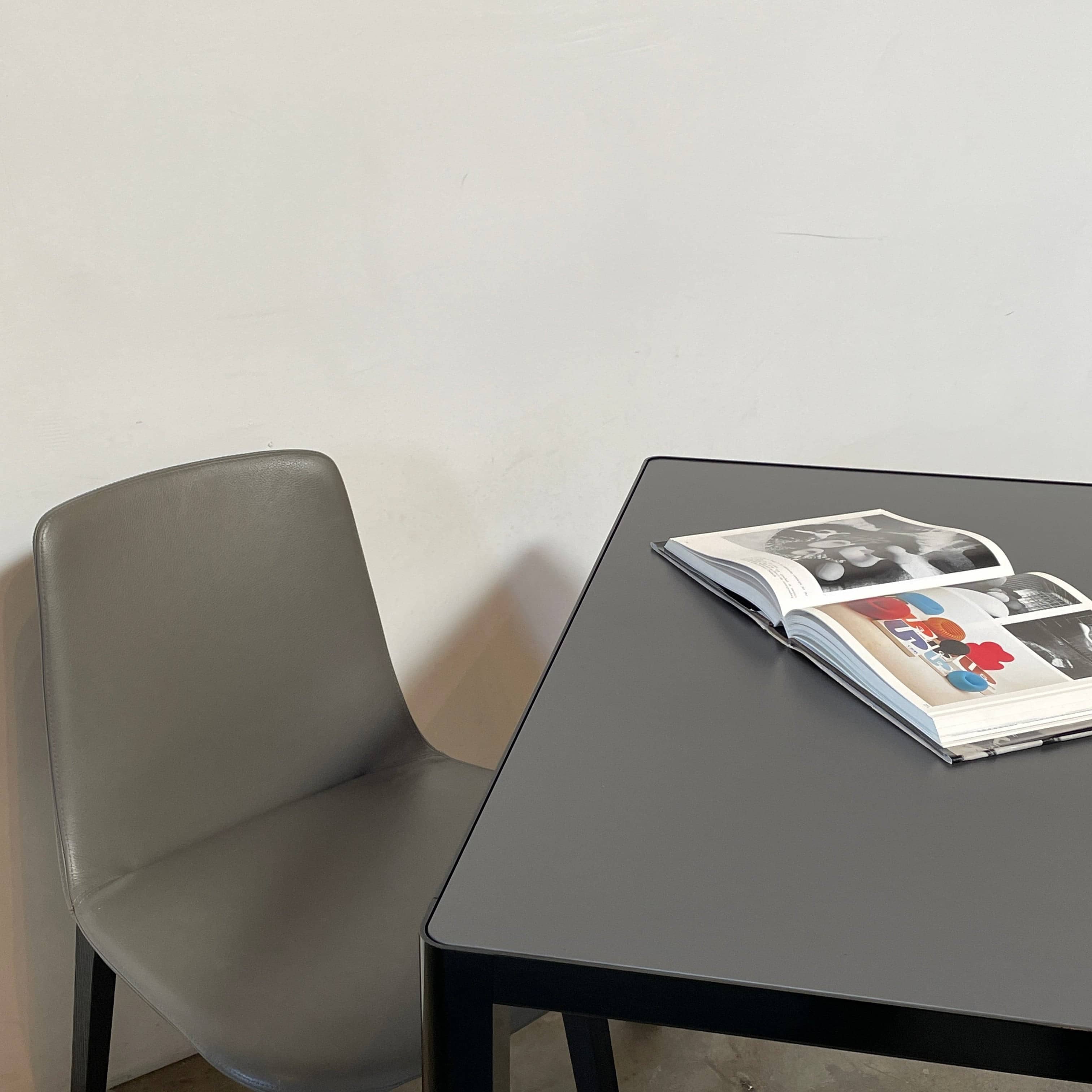 A simple Ligne Roset Seram Dining Table on a white background.