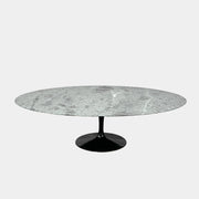The Knoll Oval Verde Alpi Marble Saarinen Table features a gray marble top and a black pedestal base, inspired by the classic design, set against a plain white background.