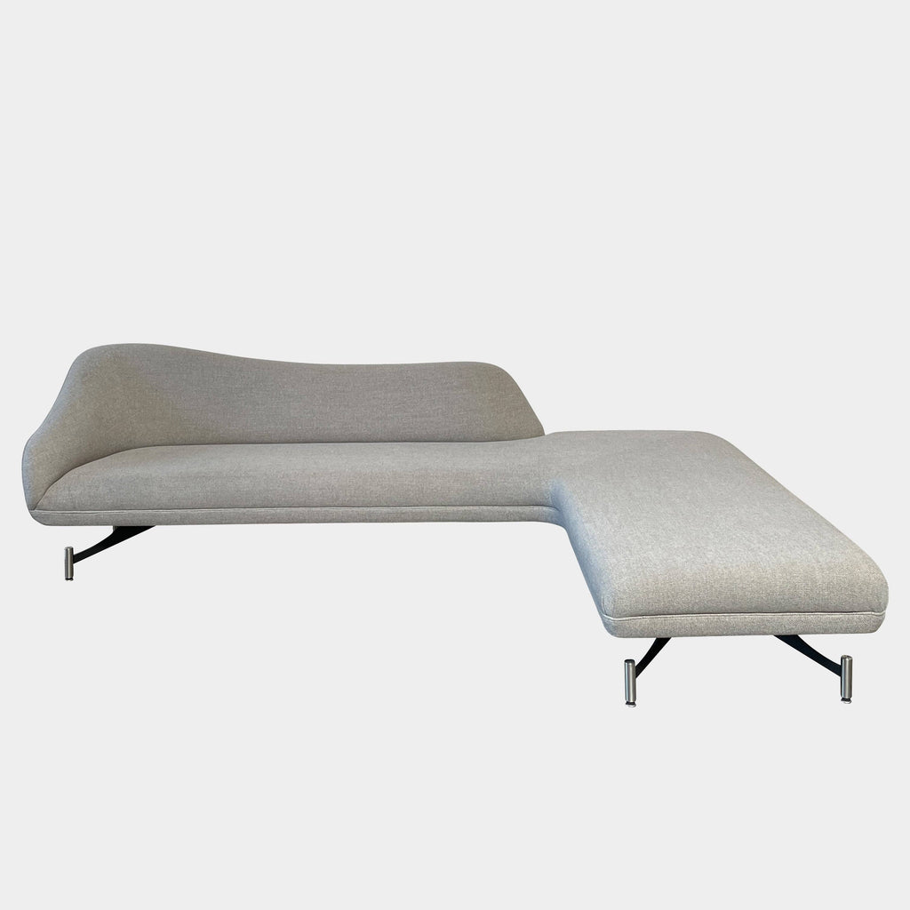 A Kagan Swan L-Shaped Sofa with legs on a white background.