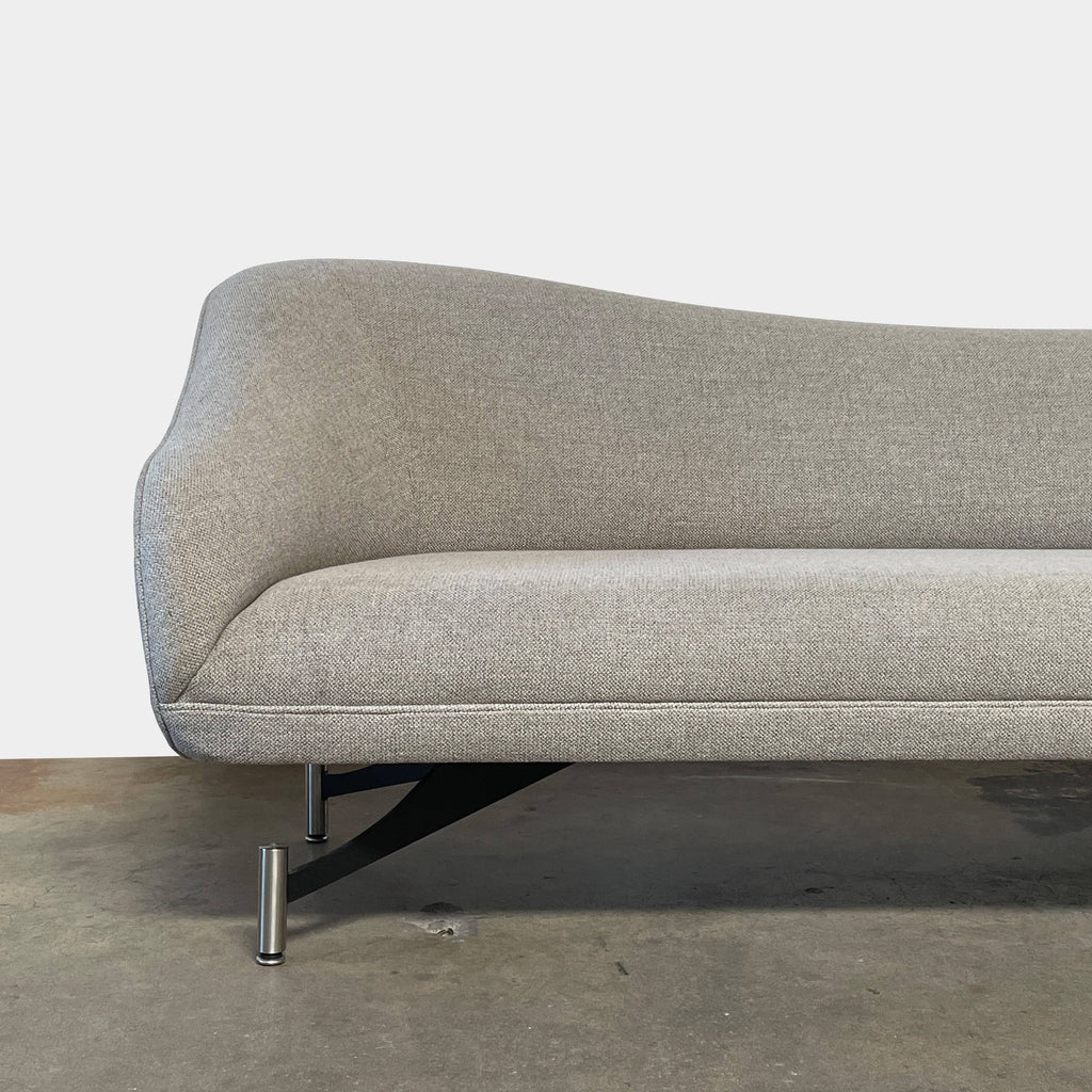 A Kagan Swan L-Shaped Sofa with legs on a white background.