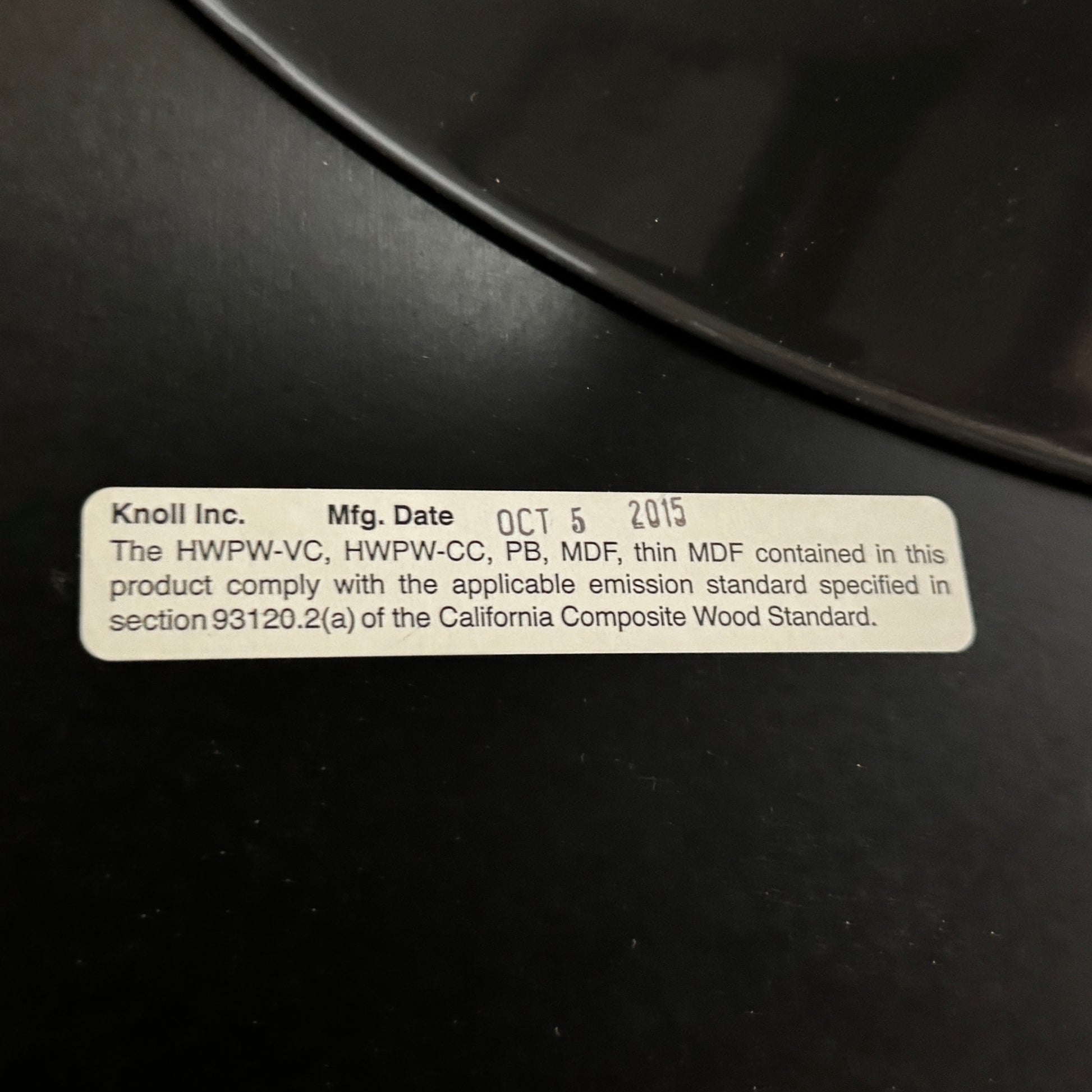 The Knoll Oval Verde Alpi Marble Saarinen Table features a gray marble top and a black pedestal base, inspired by the classic design, set against a plain white background.