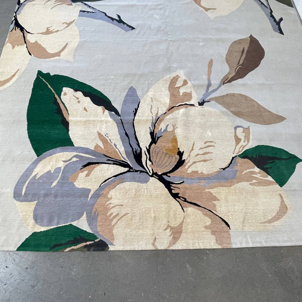 A The Rug Company Magnolia Rug with flowers on it.