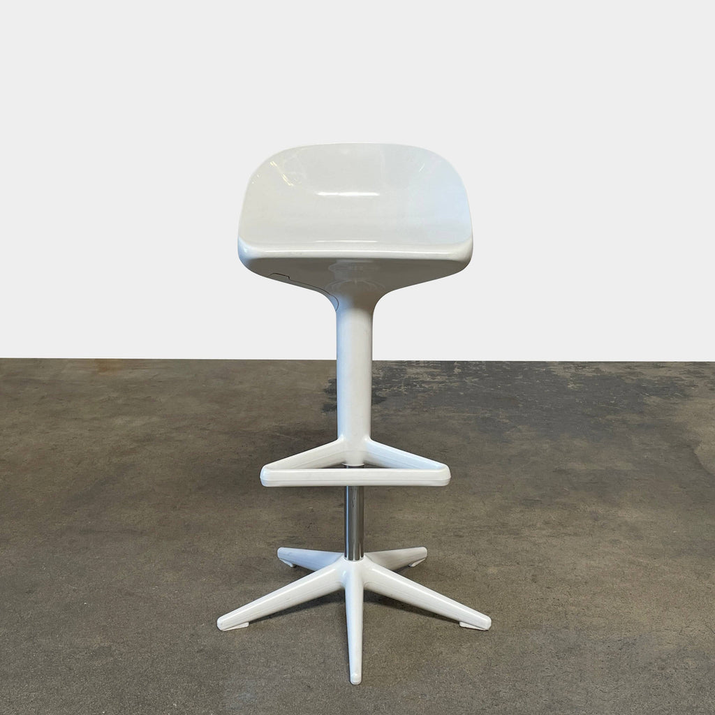 A set of four Kartell Spoon Swivel Stools on a white background.