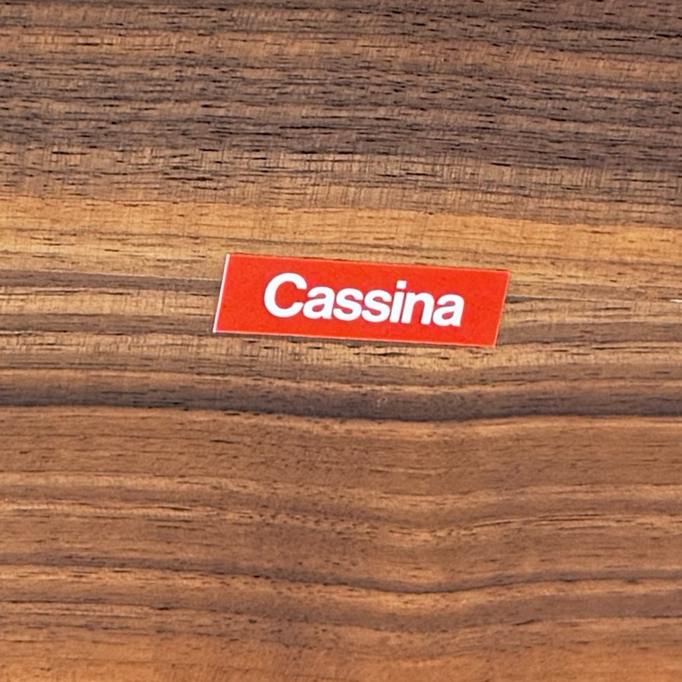 The Cassina Torei Occasional Table Natural Ash by Cassina features rounded edges and sleek black metal legs, shown on a plain white background.