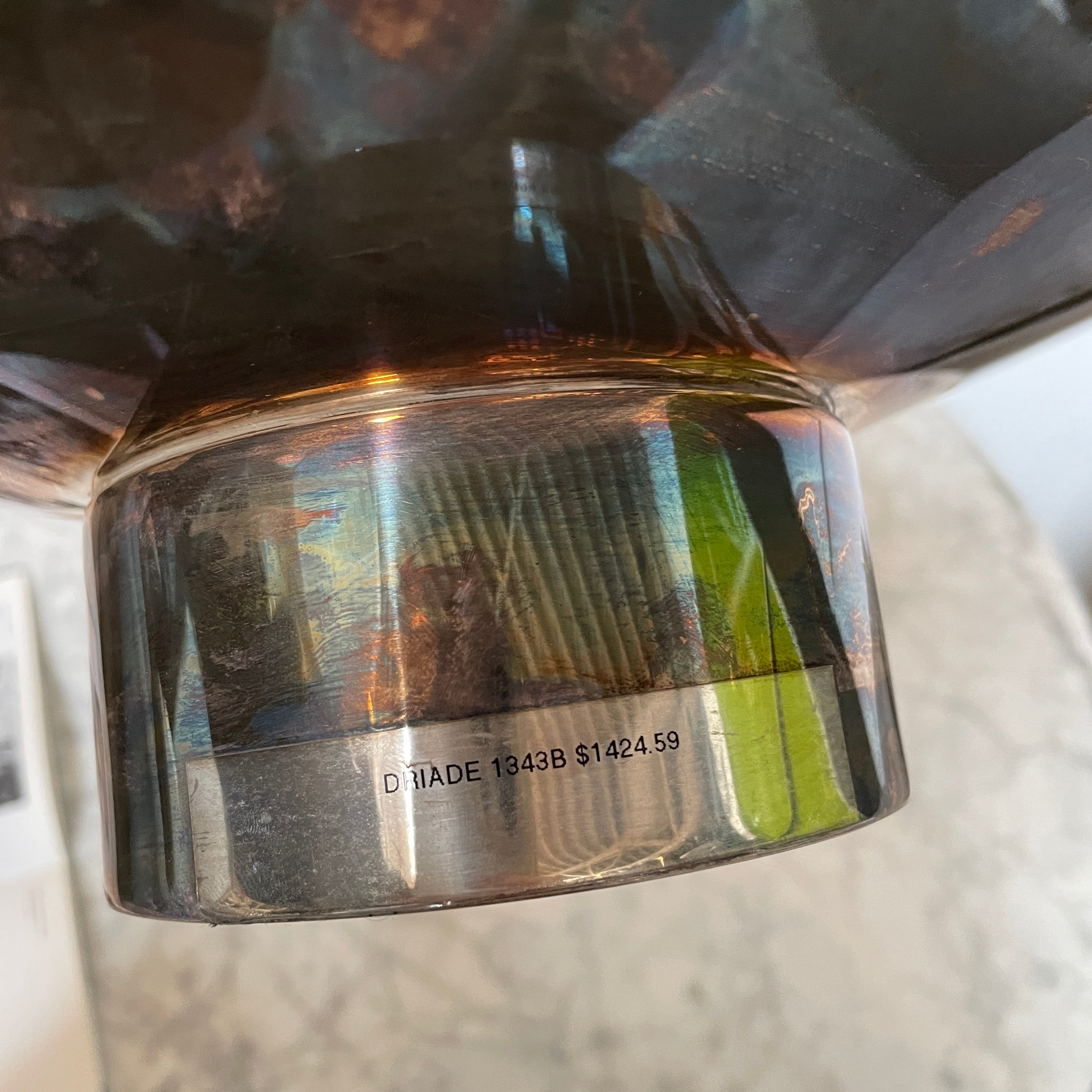 An Enzo Mari-inspired, tiered metal Driade Silver Fruit Stand Centerpiece with a reflective silver finish, isolated on a white background.