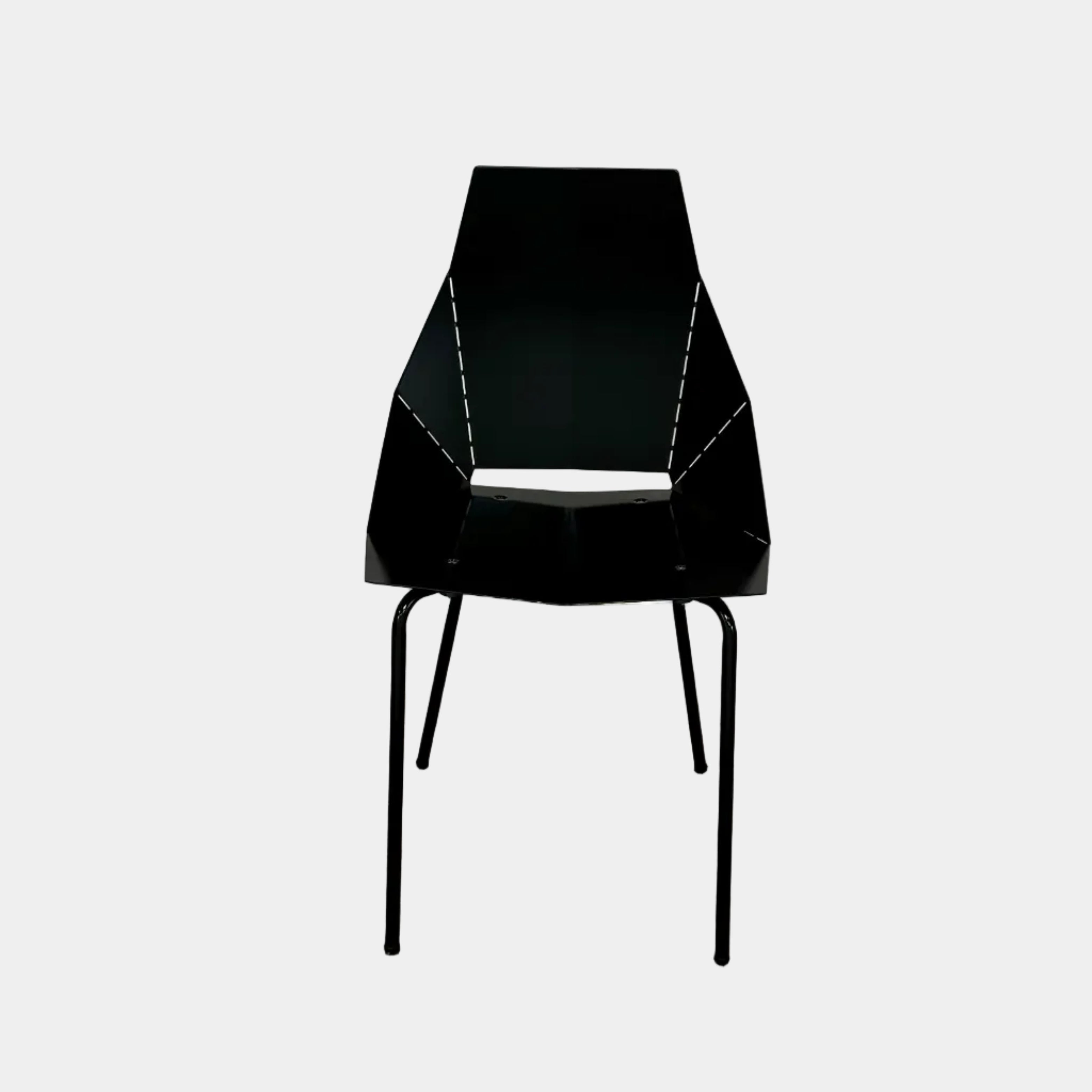 The Blu Dot “Real Good Chair” by Blu Dot is a black, angular steel chair with four metal legs and a powder-coated finish, shown against a plain white background.