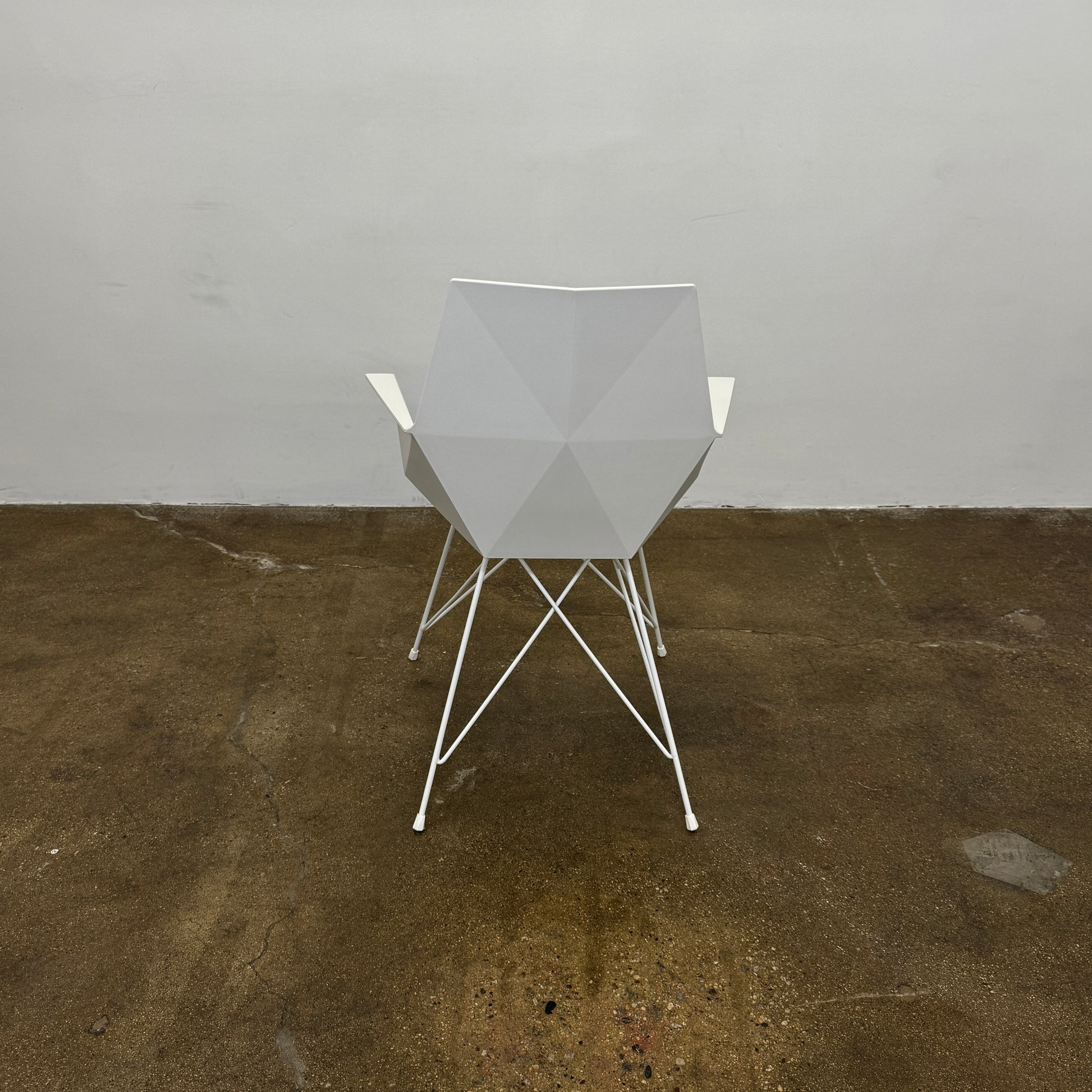 Four Vondom Faz Armchairs with steel bases, designed by Vondom, are arranged in two rows against a plain white background, highlighting their modern geometric style. Set includes four chairs.
