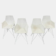 Four Vondom Faz Armchairs with steel bases, designed by Vondom, are arranged in two rows against a plain white background, highlighting their modern geometric style. Set includes four chairs.