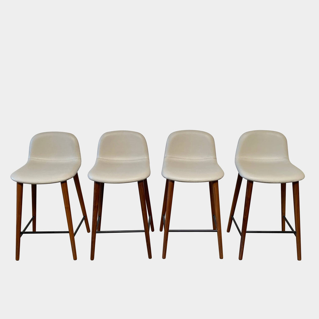 A modern set of four Jobs Bacco Counter Stools with clean lines and wooden legs on a white background.
