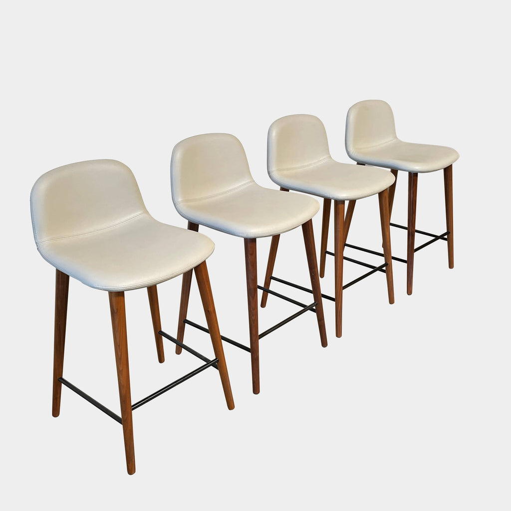 A modern set of four Jobs Bacco Counter Stools with clean lines and wooden legs on a white background.