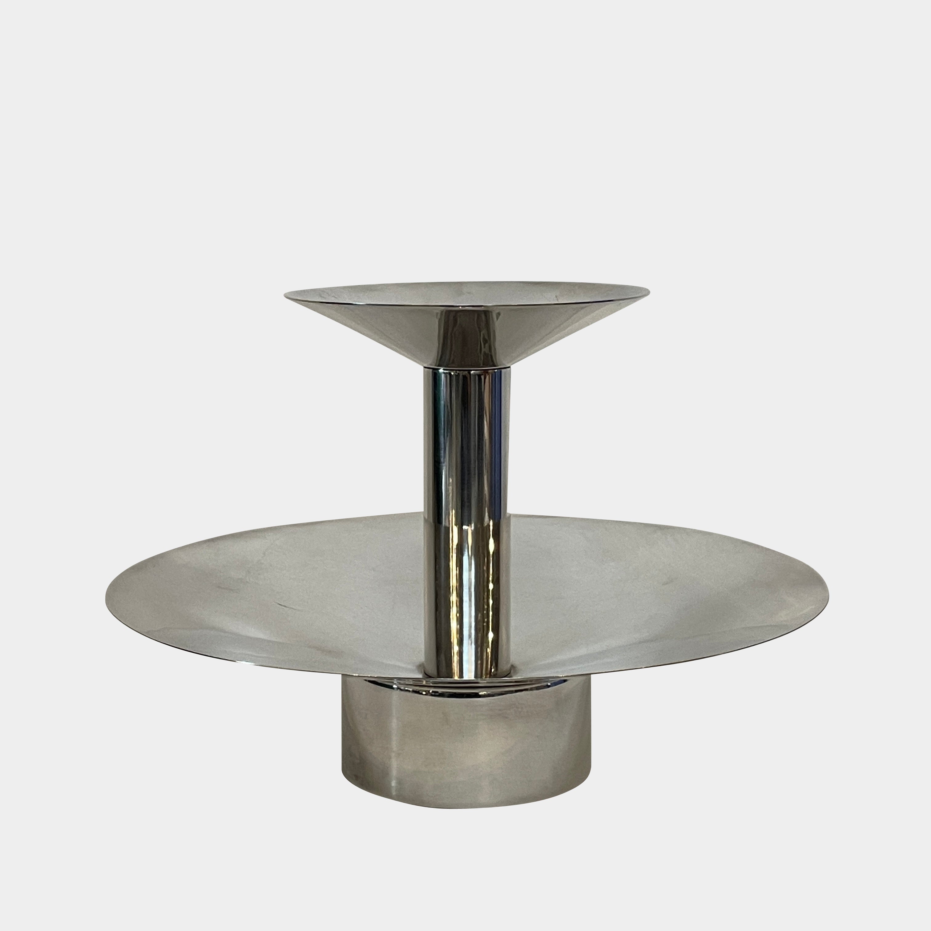 An Enzo Mari-inspired, tiered metal Driade Silver Fruit Stand Centerpiece with a reflective silver finish, isolated on a white background.