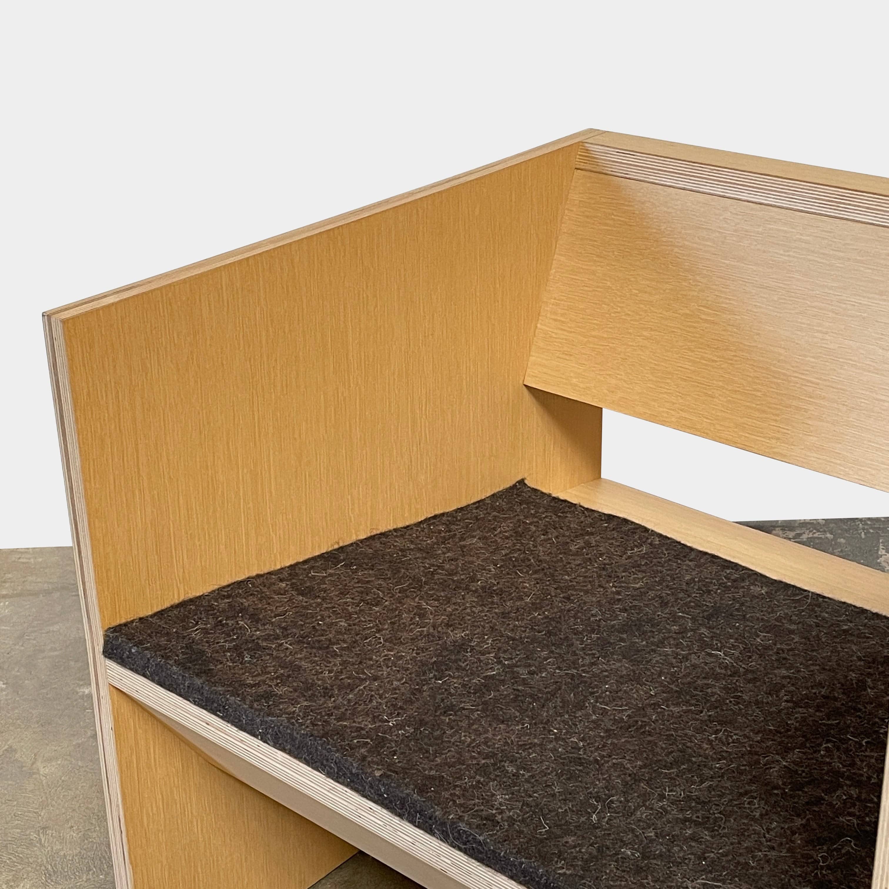 A NorCal Lounge Chair by Chris Baisa with a black cushion.