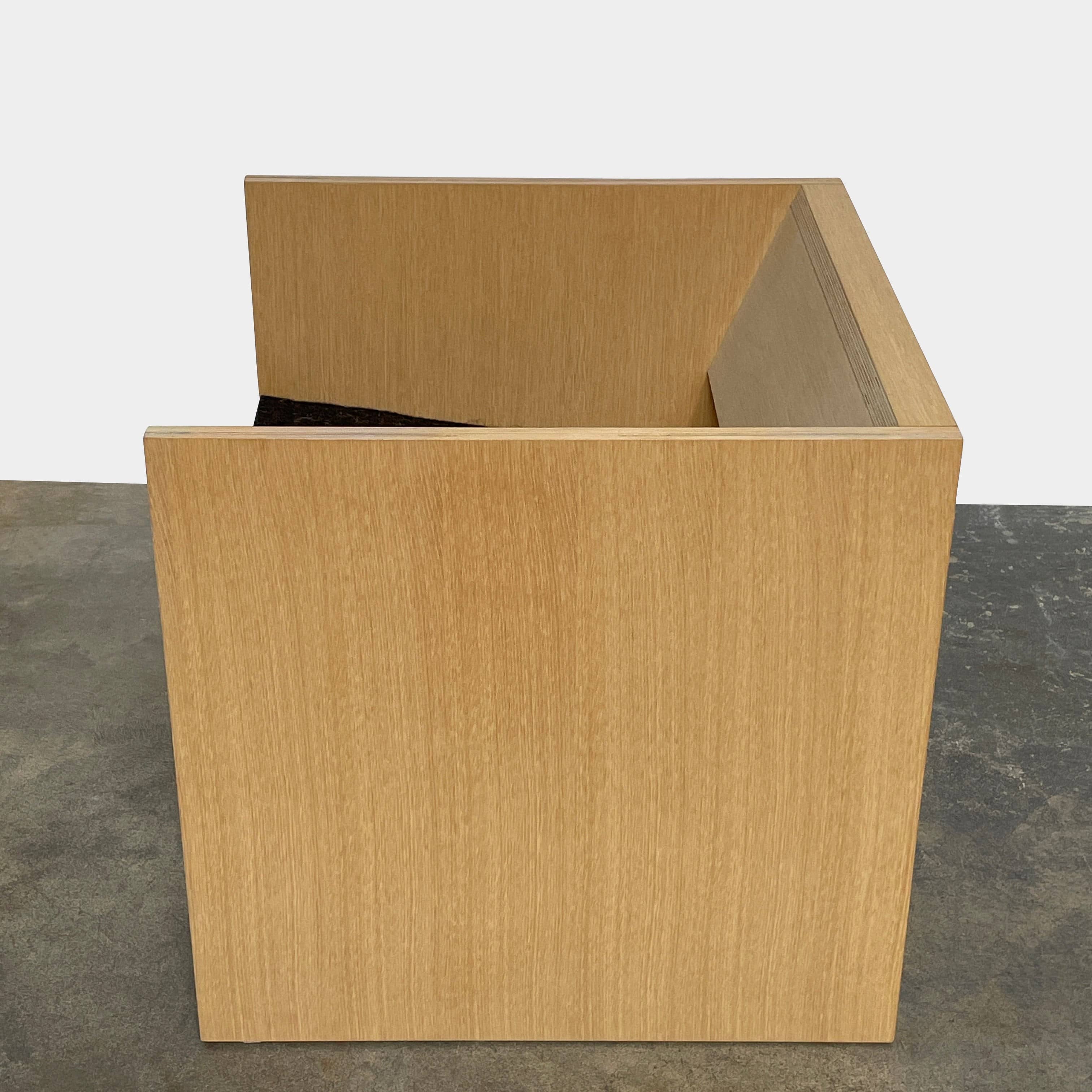 A NorCal Lounge Chair by Chris Baisa with a black cushion.