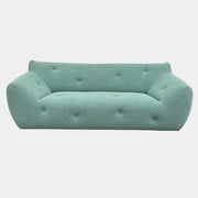 The Roche Bobois Informel Outdoor Large 3-seat Sofa Low Back features a light teal modern design with rounded edges, button-tufted details, and advanced outdoor fabric technology, inspired by Roche Bobois’s signature style.