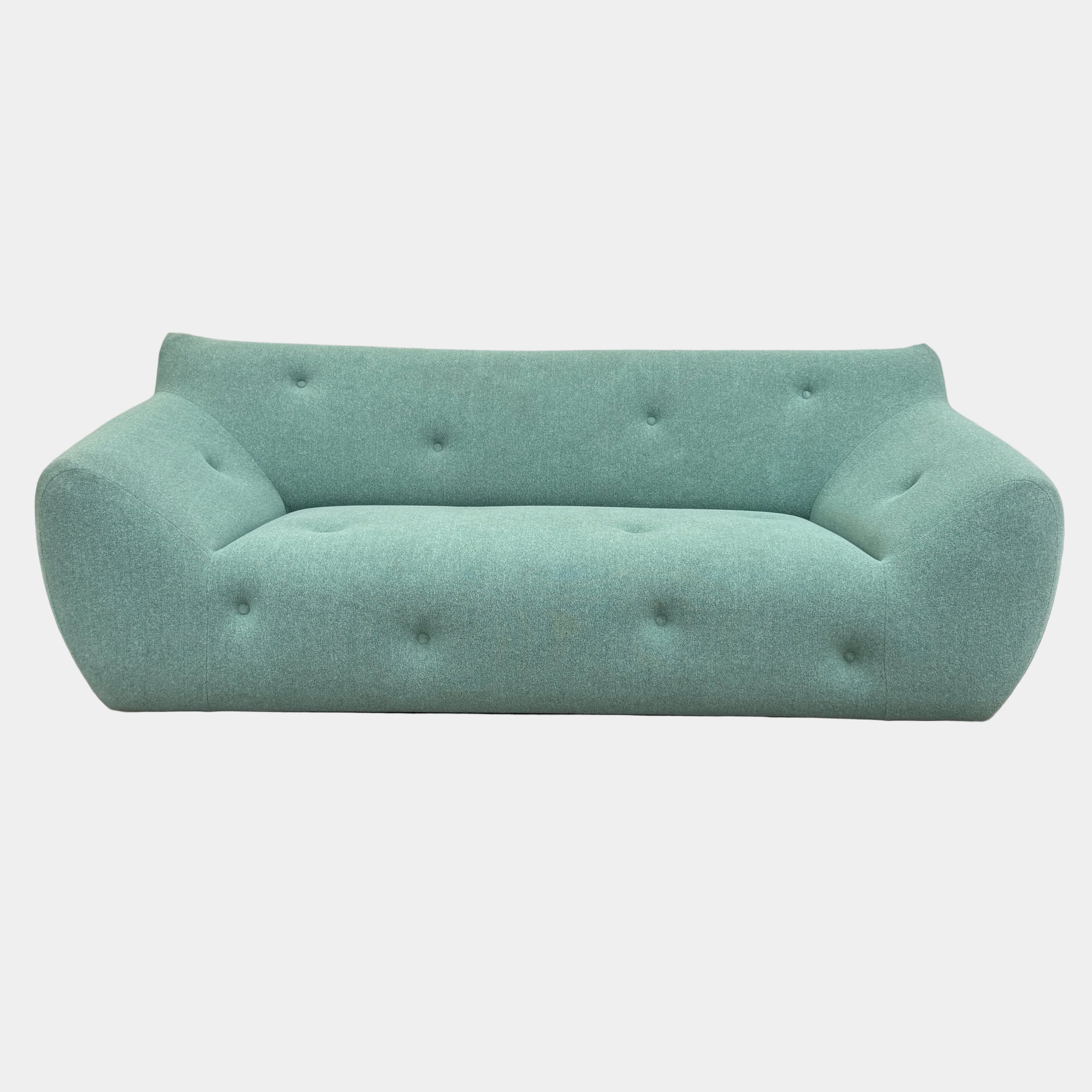 The Roche Bobois Informel Outdoor Large 3-seat Sofa Low Back features mint green upholstery, rounded edges, button-tufted accents, and innovative outdoor fabric, photographed against a white background.