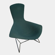 The Vintage Bertoia Bird Chair by Vintage features a modern green upholstered design with a curved backrest and metal wire base, inspired by mid-century style, photographed against a plain white background.