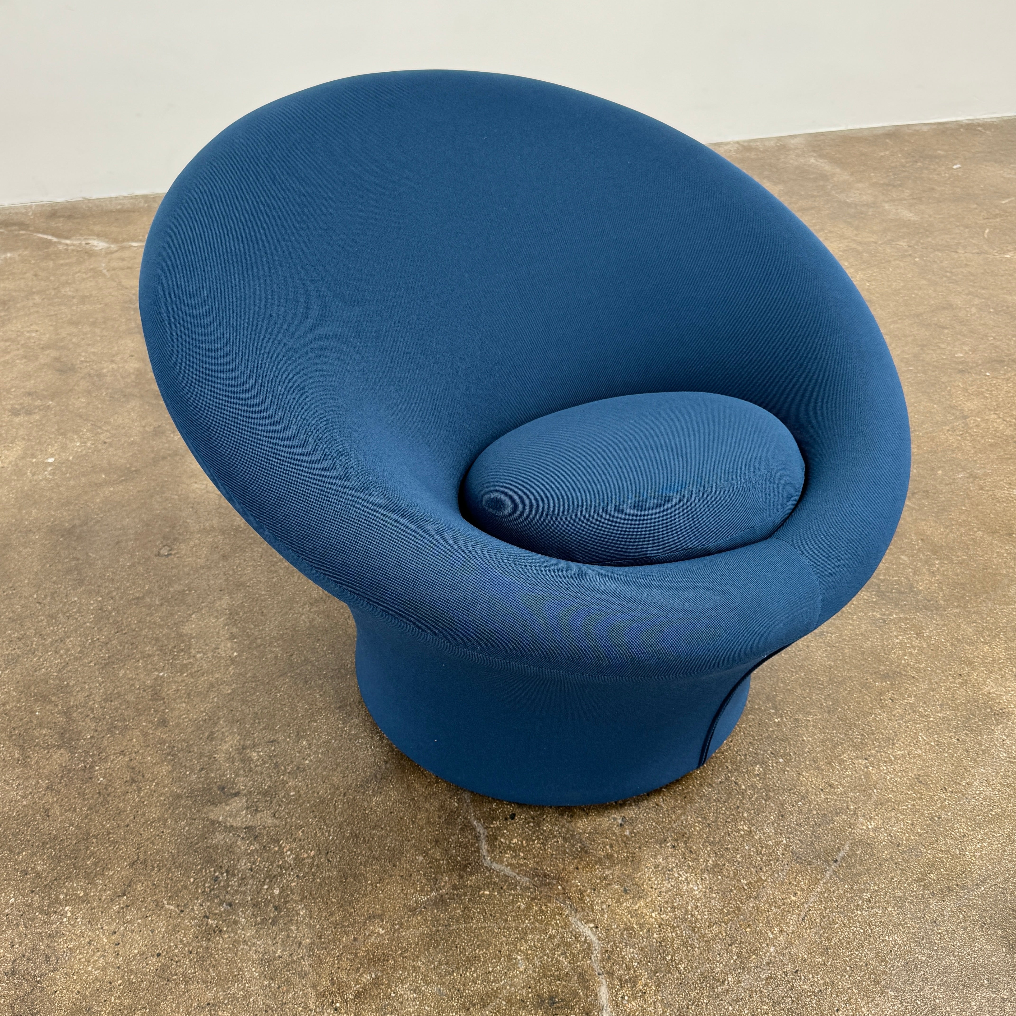 A modern blue Artifort Mushroom Chair & Ottoman by Artifort, featuring a rounded backrest and matching round ottoman, both displayed against a plain white background.