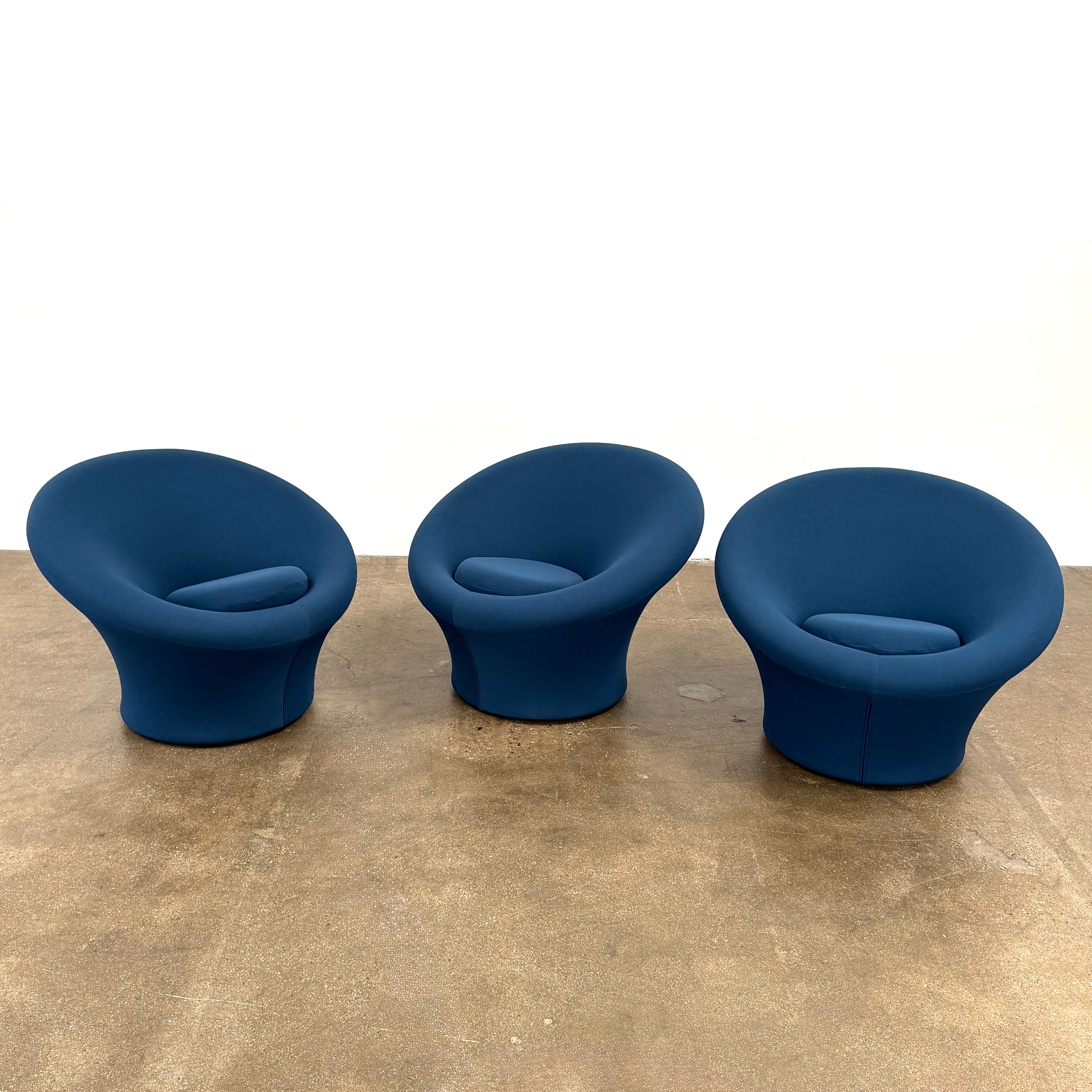 A deep blue, modern Artifort Mushroom Chair by Pierre Paulin with rounded arms and a circular seat cushion is showcased against a plain white background.
