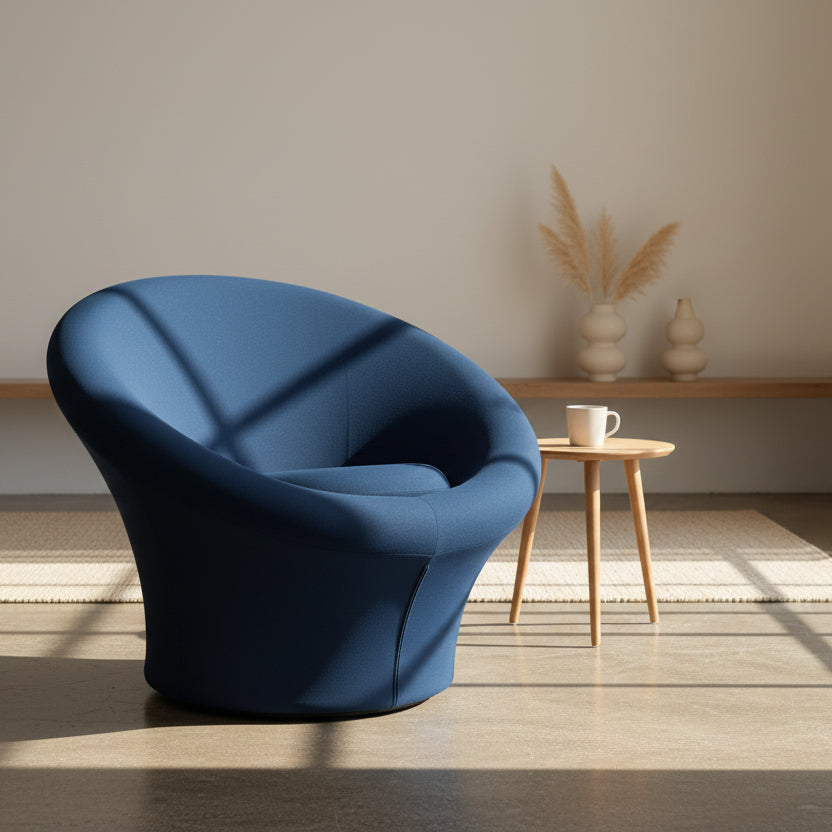 A deep blue, modern Artifort Mushroom Chair by Pierre Paulin with rounded arms and a circular seat cushion is showcased against a plain white background.