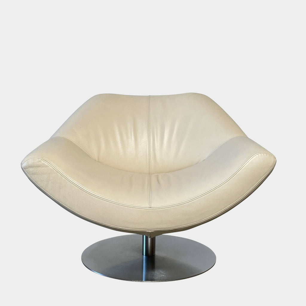 A Roche Bobois Swivel Lounge Chair on a metal base.